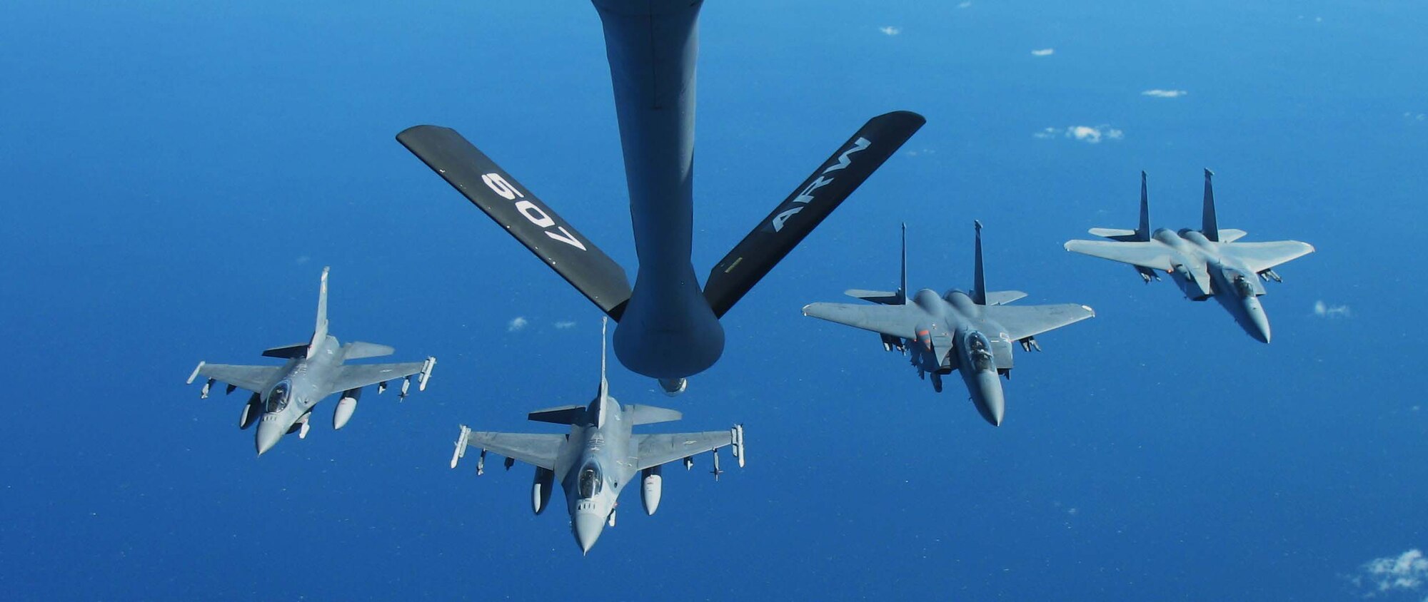 EGLIN AIR FORCE BASE - The different aircraft of the 85th Test and Evaluation Squadron, fly in formation. From left, Maj. Jason Young, Lt. Col. Sam Shaneyfelt, Maj. Paul Jeffords and Capt. Chris Crotty, and Maj. Derek Mentzer. The 85th TES pilots test new capabilities for F-15s and F-16s in an combat-simulated scenarios. (U.S. Air Force photo)