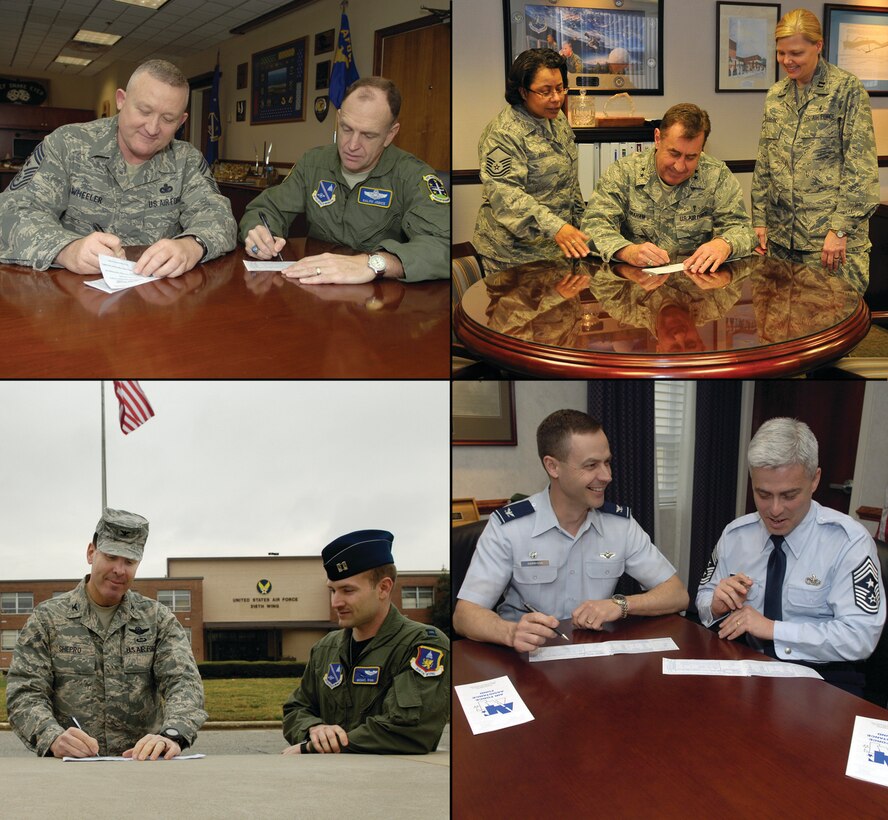 Andrews leaders sign Air Force Assistance Fund donation slips, provided by AFAF representatives, to kick off this year's fundraising  season. The AFAF campaign runs until April 24 and leaders have set a goal to make 100 percent contact with all members of their unit. (U.S. Air Force photos/ Tech. Sgt. Suzanne Day and Senior Airman Renae Kleckner)