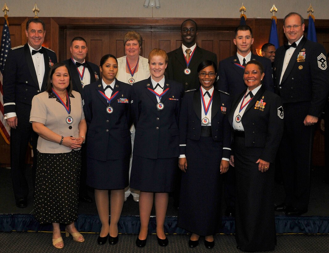 The 79th Medical Wing Annual Award recipients pose for a group photo with Maj. Gen. Gar S. Graham, 79 MDW commander, and Chief Master Sgt. Pat Battenberg, 79 MDW command chief master sergeant, at The Club at Andrews March 7.
The annual award winners were:
Airman - Senior Airman Jason R. Weigl, 779th Medical Group
Non-Commissioned Officer - Staff Sgt. Aliya Muhammad, 579th Medical Group
Senior Non-Commissioned Officer - Master Sgt. Dianna Kent, 779th Medical Group
Company Grade Officer - Capt. Stephenie Williams, 579th Medical Group
Category I Civilian - Sterlyn Jones, 579th Medical Group
Category II Civilian - Elaine Ingle, 779th Medical Group
Category III Civilian - Erlinda Alcones, 779th Medical Group
Military Volunteer - Airman 1st Class Lisa Y. Kennedy, 579th Medical Group
Category I Volunteer - Helena Small, 779th Medical Group
First Sergeant - Senior Master Sgt. John Turner, 779th Medical Group
Honor Guard Member - Airman 1st Class Eddie Algarin, 779th Medical Group