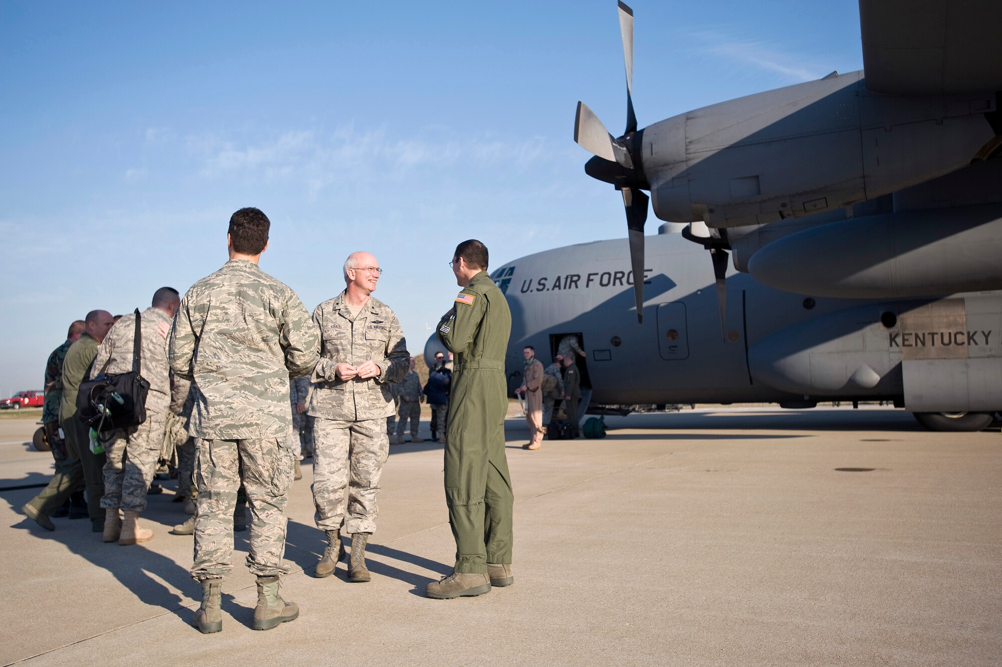 Kentucky Assistant Adjutant General for Air Brig. Gen. Mark Kraus (second from right), wishes Kentucky Air Guardsmen well March 18 as they board a C-130 en route to Afghanistan. The Airmen will be providing airlift services as part of Operation Enduring Freedom through May 19. (USAF photo by Capt. Dale Greer).