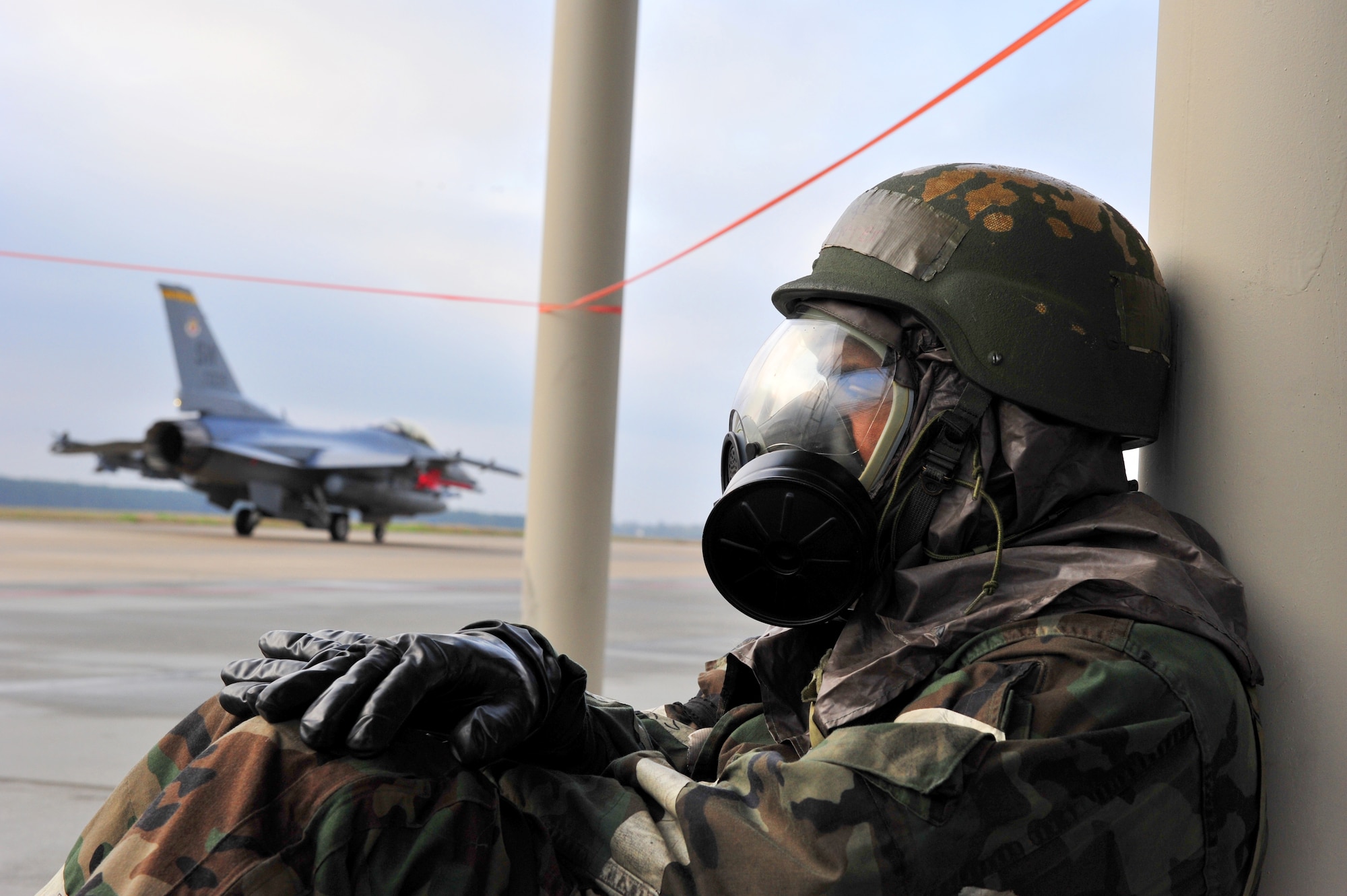 SHAW AIR FORCE BASE, S.C.-- Airmen from the 20th Maintenance Group launch F-16s even while hampered by wearing full biological and chemical protective suits during an operational readiness exercise, March 17, 2009. While cumbersome, the suits provide protection against biological and chemical environments. This ORE is crucial to Shaw's preparation for an upcoming operational readiness inspection in June. (U.S. Air Force Photo by Senior Airman William Coleman)