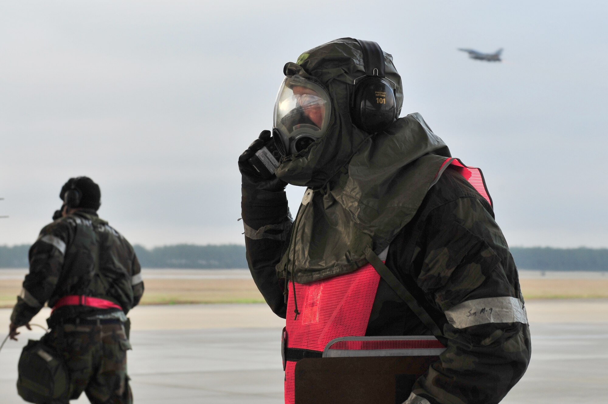 SHAW AIR FORCE BASE, S.C.-- Airmen from the 20th Maintenance Group launch F-16s even while hampered by wearing full biological and chemical protective suits during an operational readiness exercise, March 17, 2009.  While cumbersome, the suits provide protection against biological and chemical environments.  This ORE is crucial to Shaw's preparation for an upcoming operational readiness inspection in June. (U.S. Air Force Photo by Senior Airman William Coleman)