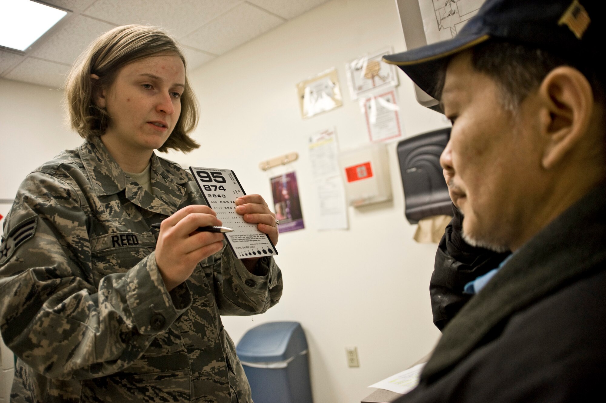 Senior Airman Samantha Reed, an optometry technician from McConnell Air Force Base, Kan., conducts an eye examination on a patient March 10 at a health clinic in Kwethluk, Alaska. A joint military medical team deployed to Kwethluk, a small village in Western Alaska, in support of Operation Arctic Care 2009. This year's Navy-led mission had teams in 11 villages in Alaska's Yukon-Kuskokwim Delta region providing medical, dental and veterinary support at no cost to Alaskan natives. (U.S. Air Force photo/Senior Airman Christopher Griffin)