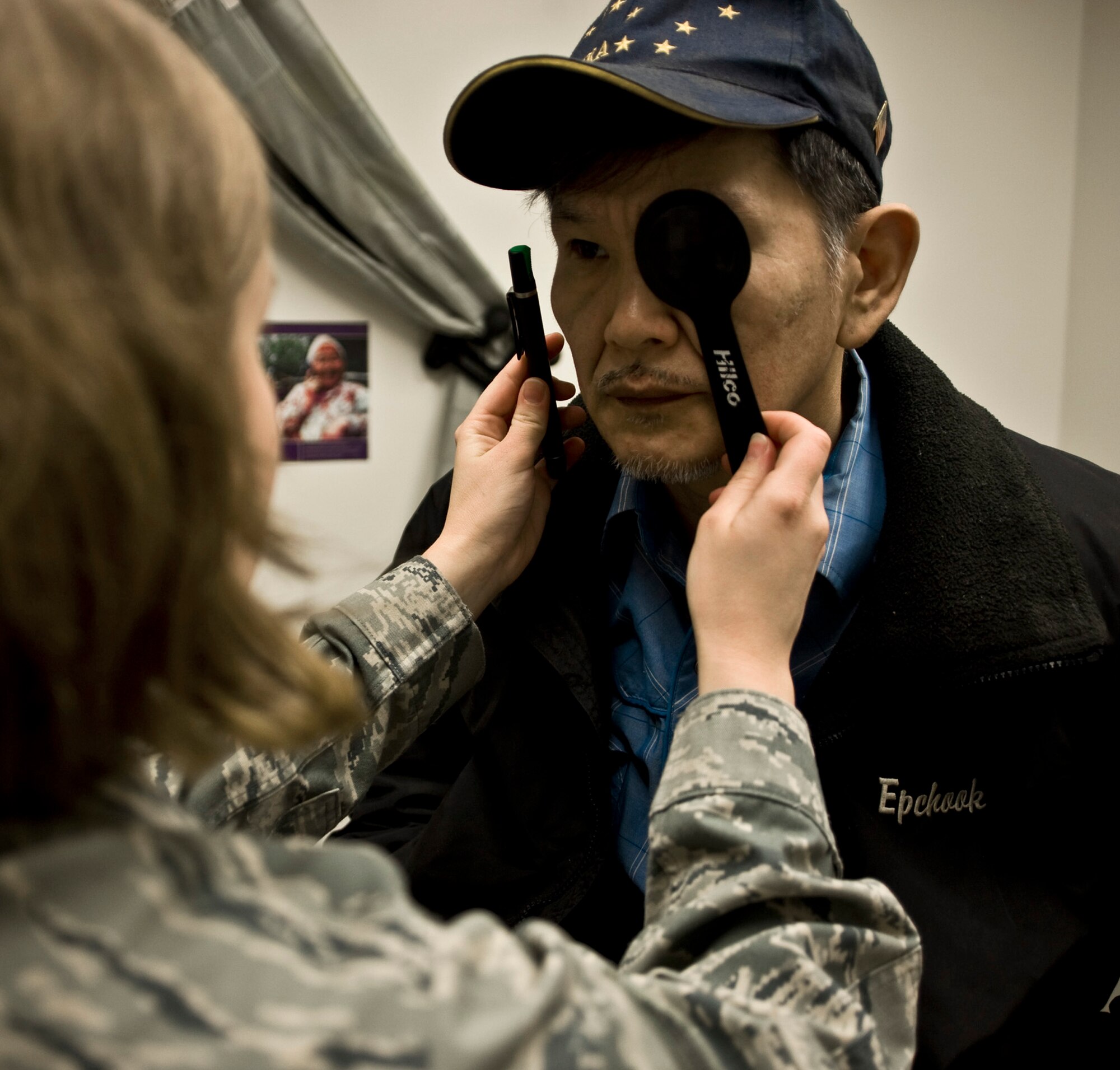 Senior Airman Samantha Reed, an optometry technician from McConnell Air Force Base, Kan., tests a patient's peripheral vision March 10 at a health clinic in Kwethluk, Alaska. A joint military medical team deployed to Kwethluk, a small village in Western Alaska, in support of Operation Arctic Care 2009. This year's Navy-led mission had teams in 11 villages in Alaska's Yukon-Kuskokwim Delta region providing medical, dental and veterinary support at no cost to Alaskan natives. (U.S. Air Force photo/Senior Airman Christopher Griffin)