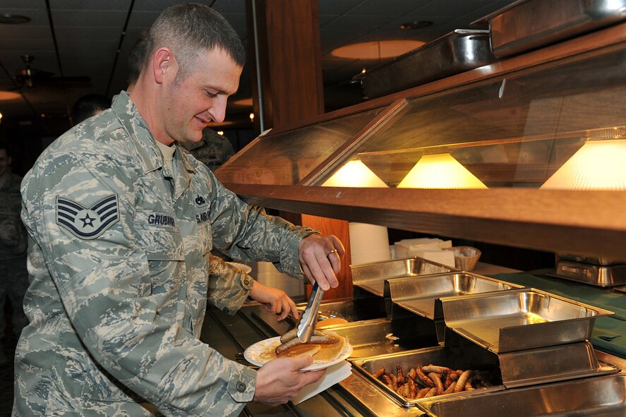 OFFUTT AIR FORCE BASE, Neb. -- Staff Sgt. Jason Grubaugh, 373rd Training Squadron, pours syrup onto his pancakes during the Air Force Assistance Fund during a kick-off breakfast at the Patriot Club Mar. 17. The Air Force Assistance Fund was established as an annual effort to raise funds for the Air Force family the Air Force Village Foundation, Inc., the Air Force Aid Society, Inc., the Gen. and Mrs. Curtis E. LeMay Foundation, and the Air Force Enlisted Village.

U.S. Air Force Photo by Charles Haymond