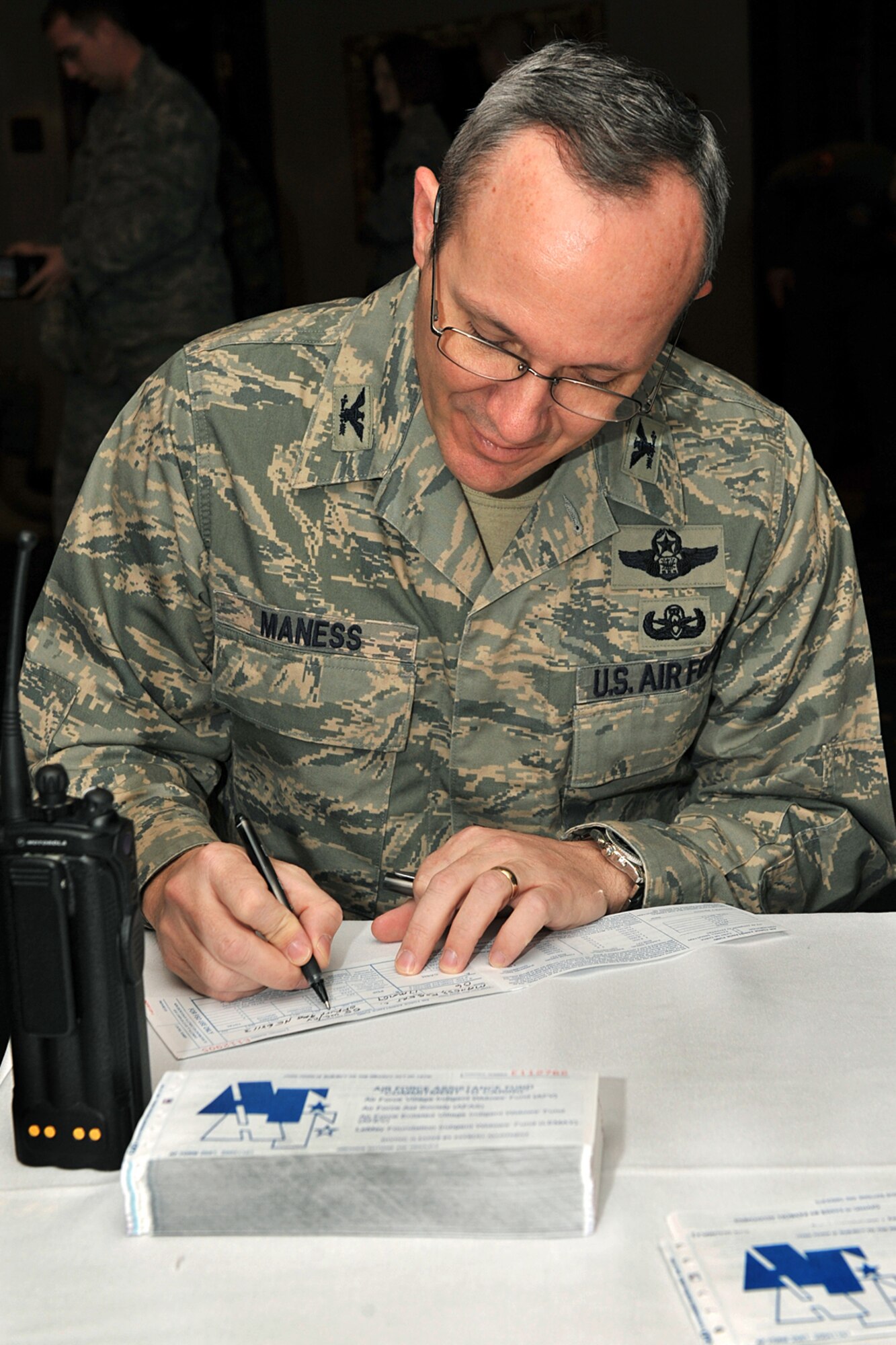 OFFUTT AIR FORCE BASE, Neb. -- Col. Robert Maness, 55th Wing vice commander, pledges a donation to help in the Air Force Assistance Fund during a kick-off breakfast at the Patriot Club Mar 17. The Air Force Assistance Fund was established as an annual effort to raise funds to support the Air Force family the Air Force Village Foundation, the Air Force Aid Society, the Gen. and Mrs. Curtis E. LeMay Foundation, and the Air Force Enlisted Village. 

U.S. Air Force Photo By Charles Haymond