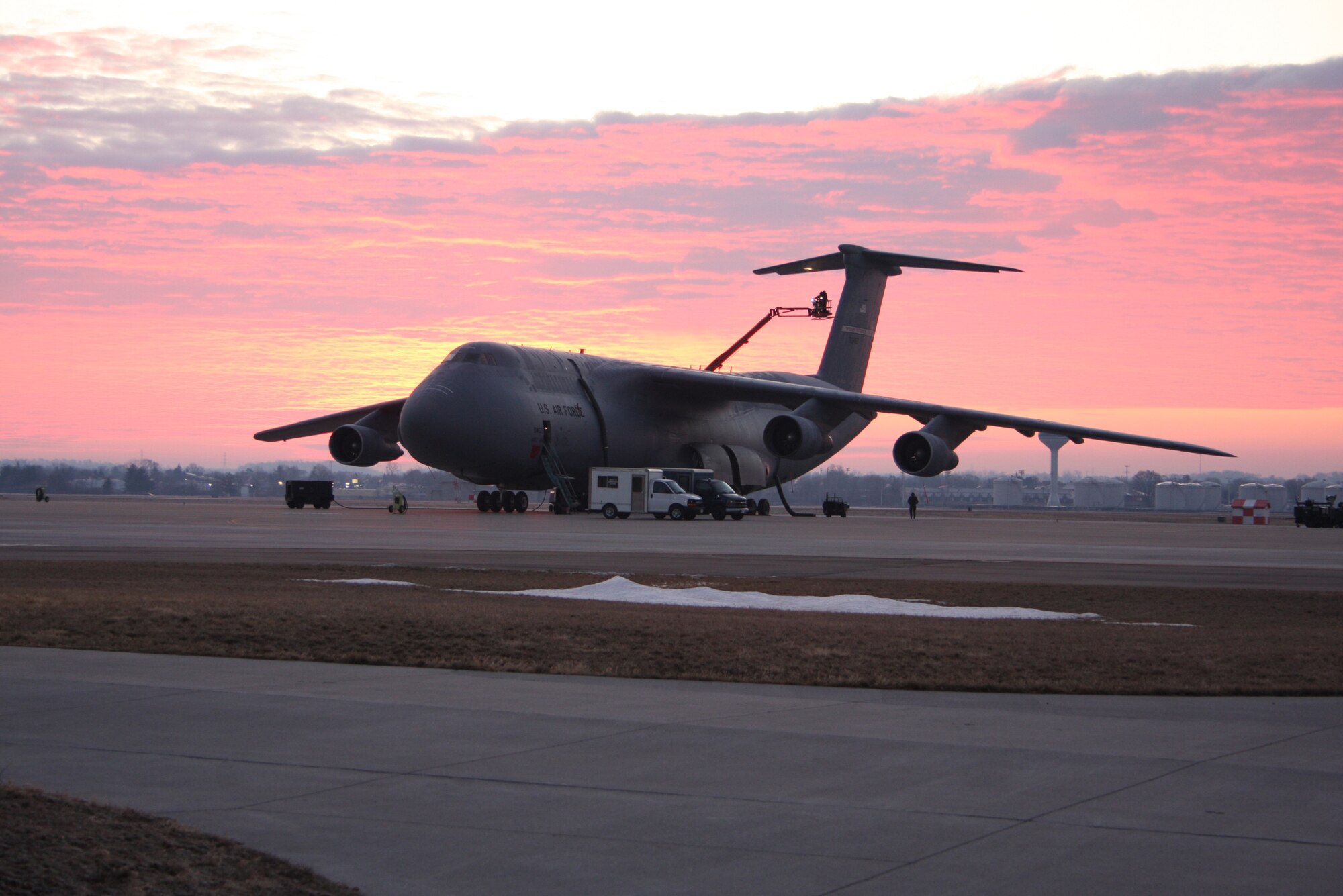 WRIGHT-PATTERSON AFB, Ohio – Airmen from the 445th Airlift Wing had the opportunity to witness a beautiful sunrise as they prepped a C-5A Galaxy for an early flight.  (Air Force photo/Senior Airman Ken LaRock) 