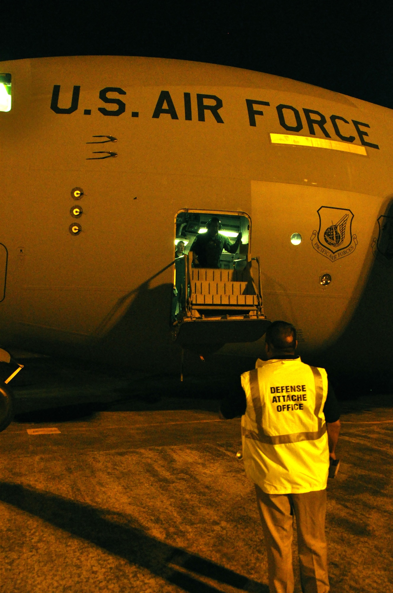 WHENUAPAI AIR BASE, New Zealand  -- U. S. Navy Chief Warrant Officer Lawrence Quevedo, U.S. Defense Attache' Office operations coordinator, prepares to greet the C-17 crew, 3rd Wing,  Elmendorf Air Force Base, Alaska, upon their arrival at Royal New Zealand Air Force Base here March 18 to participate in the Whenuapai Air Show. This will be the first time since 1981 that a U.S. aircraft has participated in the annual event. (U.S.  Air Force photo/Tech Sgt. Cohen A. Young) 