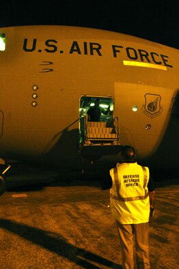 WHENUAPAI AIR BASE, New Zealand  -- U. S. Navy Chief Warrant Officer Lawrence Quevedo, U.S. Defense Attache' Office operations coordinator, prepares to greet the C-17 crew, 3rd Wing,  Elmendorf Air Force Base, Alaska, upon their arrival at Royal New Zealand Air Force Base here March 18 to participate in the Whenuapai Air Show. This will be the first time since 1981 that a U.S. aircraft has participated in the annual event. (U.S.  Air Force photo/Tech Sgt. Cohen A. Young) 