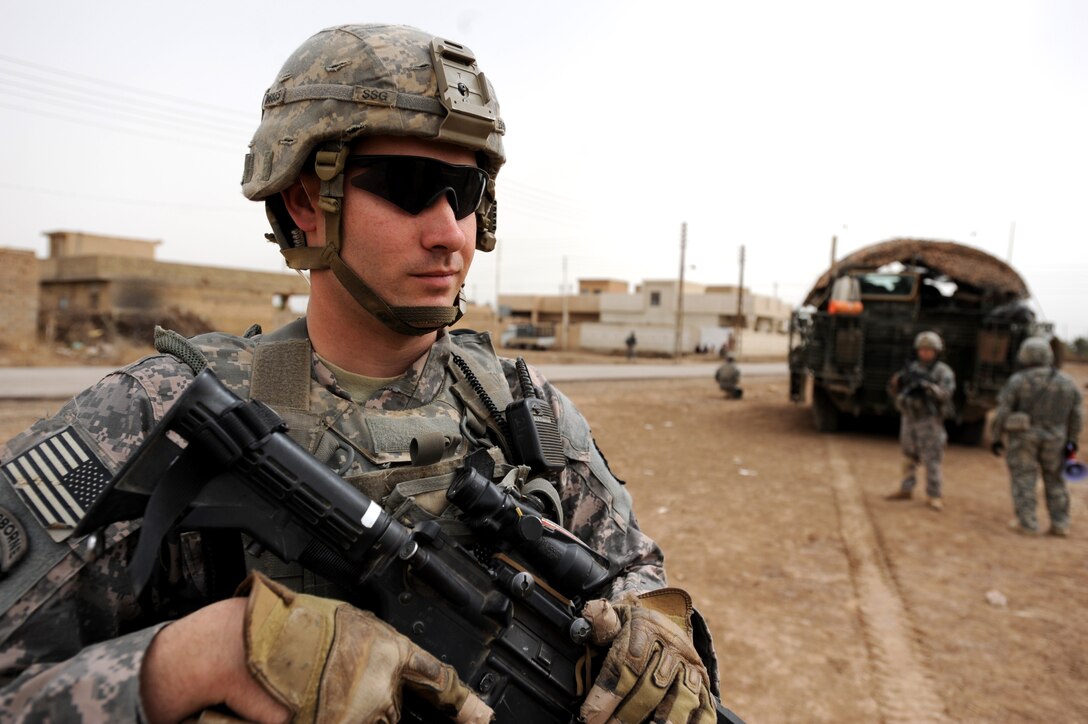 U.S. Army Staff Sgt. Michael Brown prepares to conduct a dismounted patrol through the northeastern section of the city of Tarmiyah, Iraq, with other soldiers from his platoon, March 13, 2009. Brown is assigned to Company C, 1st Battalion, 111th Infantry Regiment, 56th Stryker Brigade Combat Team, 28th Infantry Division, Pennsylvania National Guard, Multinational Division Baghdad.