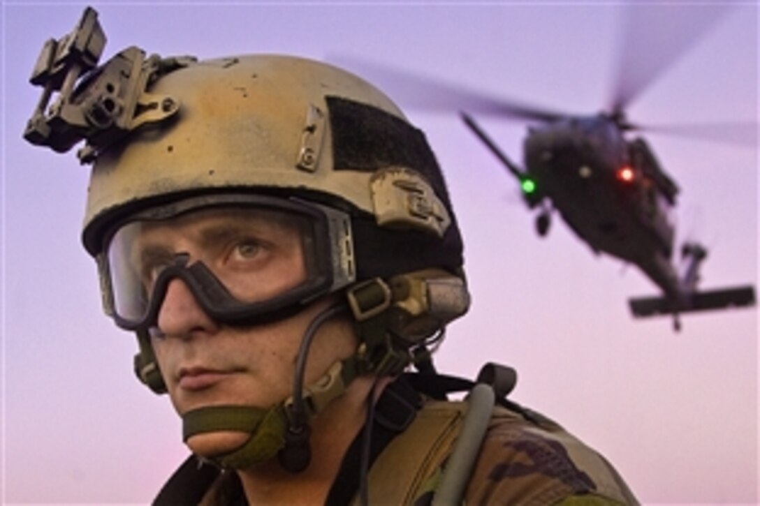 U.S. Air Force Senior Airman Richard Boyd provides security during a rescue training mission in preparation for the space shuttle mission STS-119 on Patrick Air Force Base, Fla., March 9, 2009. Boyd is a pararescueman assigned to the Air Force Reserve Command's 920th Rescue Wing.