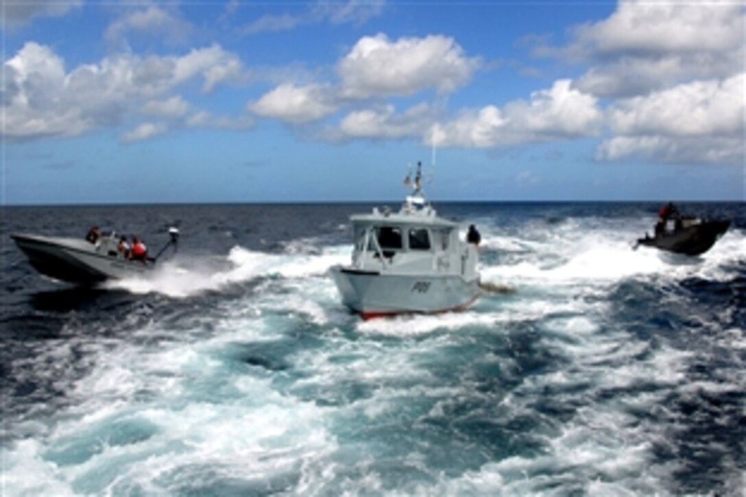 Small boats participate in a "high-value asset escort exercise" off the coast of Barbados at the culmination of a two-week waterborne security course taught by members of the U.S. Navy Expeditionary Training Command in Bridgetown, Barbados, March 19, 2009. The course is part of a U.S. Navy training mission to Central America, South America and the Caribbean Basin.