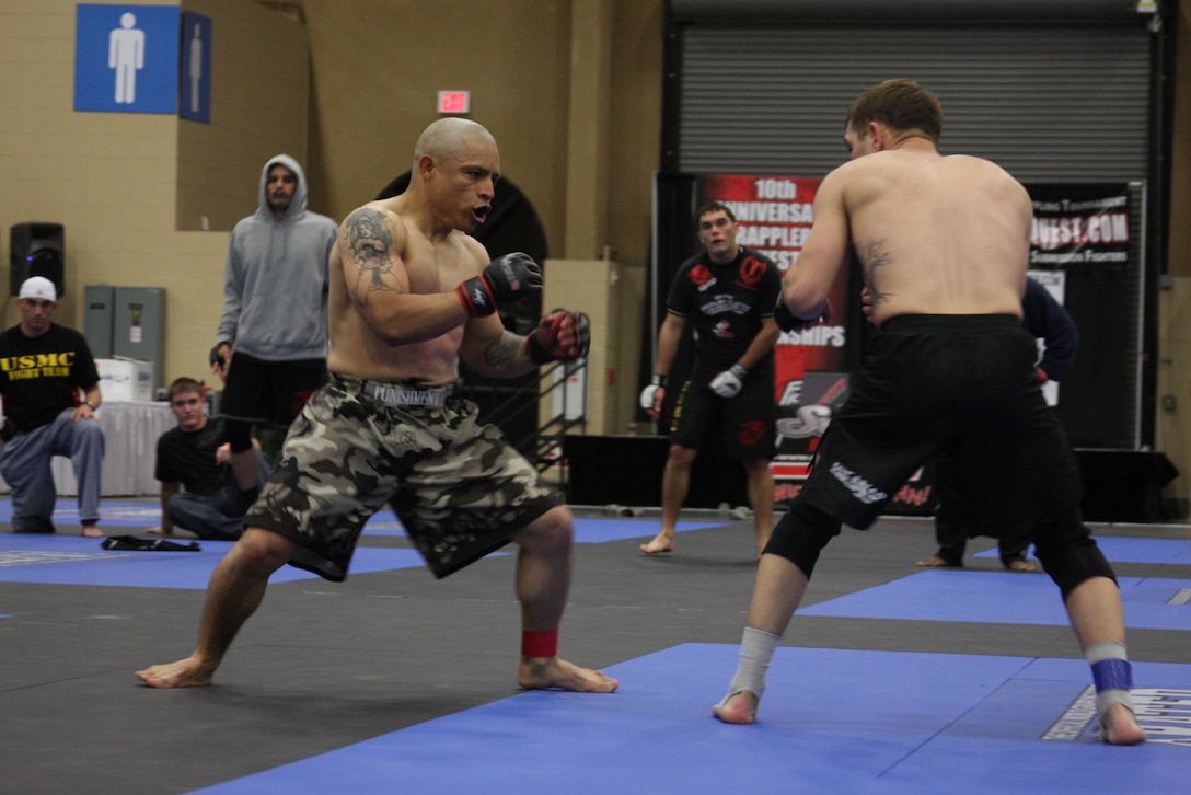 Lightweight Fight Club 29 member Joey Yeampierre faces up with his opponent from the Marine Corps Base Camp Pendleton, Calif., team at the Fight Expo pankration tournament at the Del Mar Fairgrounds in Del Mar, Calif., March 21.