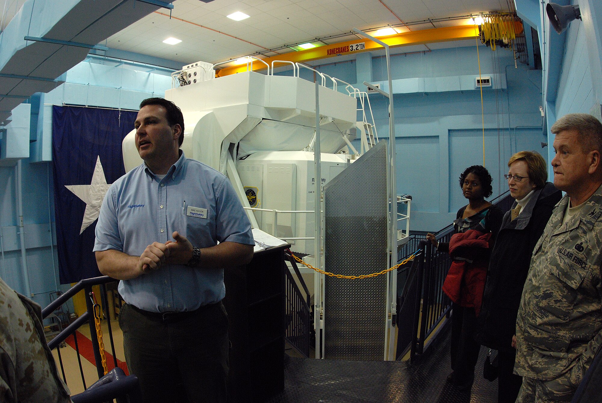 Mike Nason, a contractor with Flight Safety, answers questions about C-5 flight simulators from civic leaders visiting the 433rd Airlift Wing. The group was hosted by the 94th Fighter Wing from Dobbins ARB, Ga. (U.S. Air Force photo/Airman Brian McGloin)