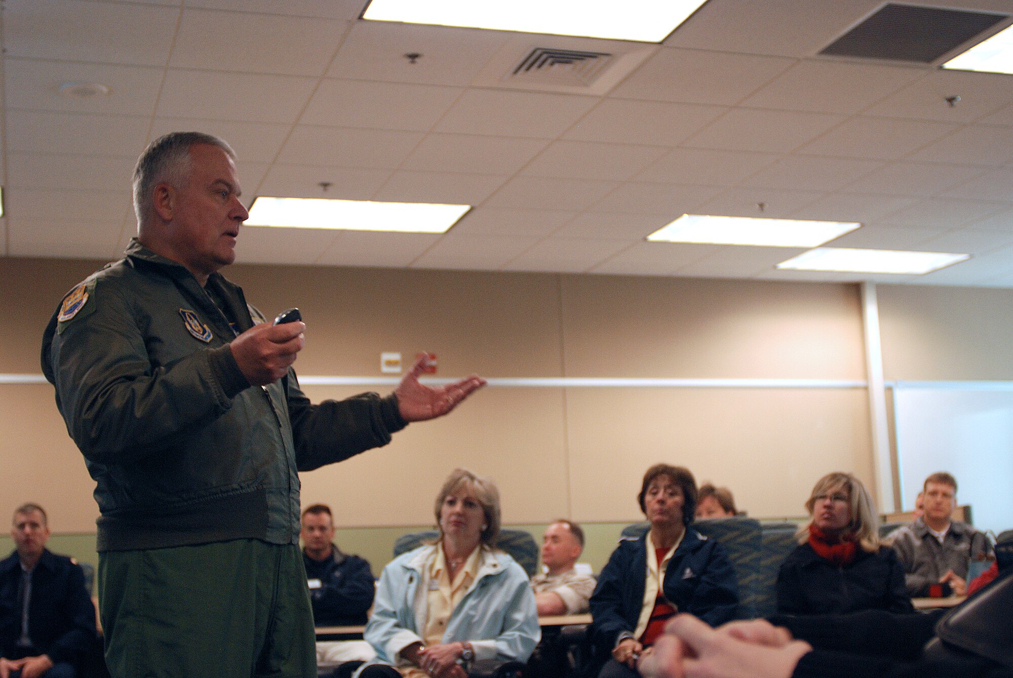 Brigadier General John Fobian addresses members of a civic leader tour visiting the 433rd Airlift Wing from Dobbins ARB, Ga. General Fobian explains the daily operations of the 433rd AW, the history of the C-5A Galaxy and tells them how the Air Force Reserve at Lackland contributes to the fight. (U.S. Air Force Photo/Airman Brian McGloin)