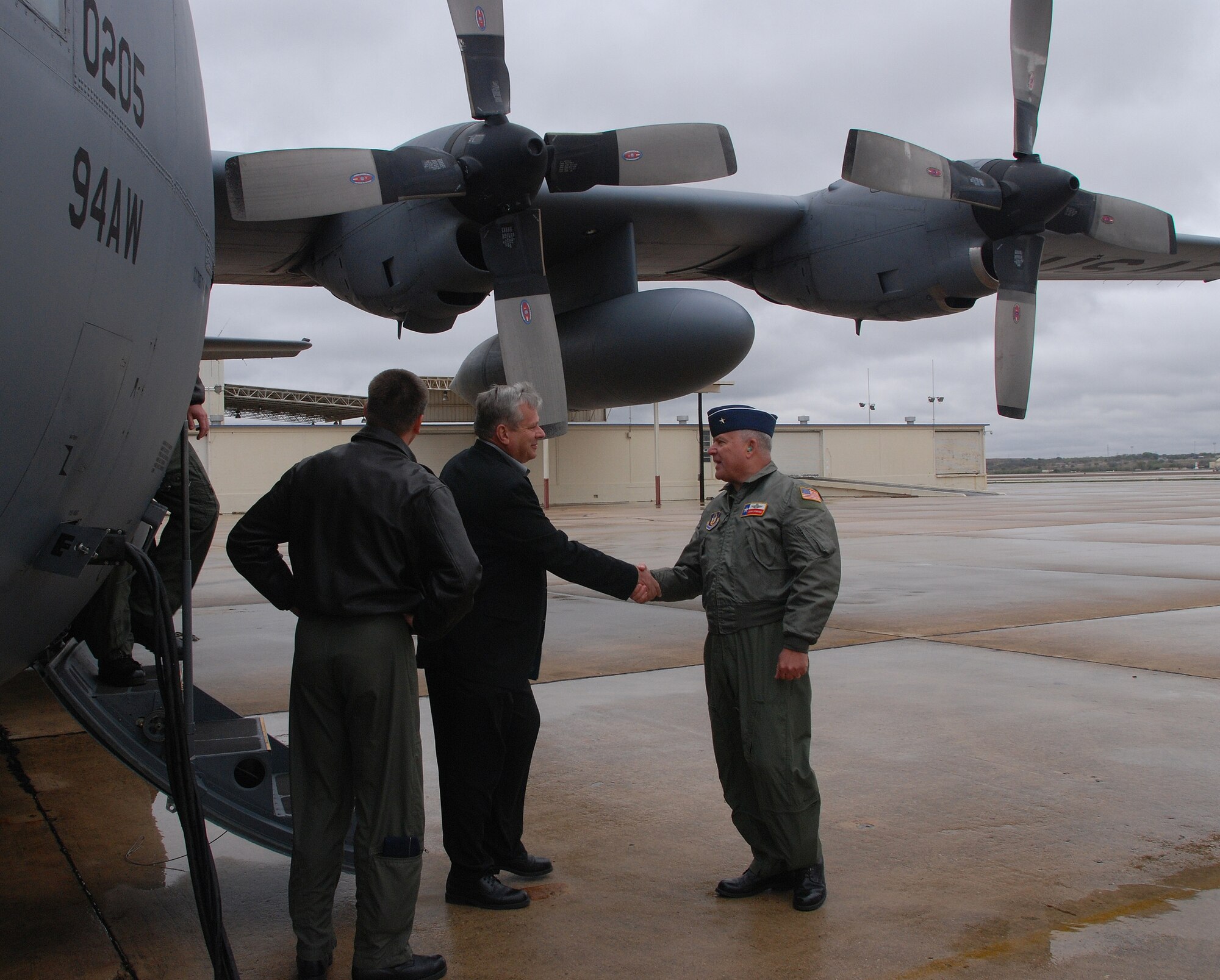 Brigadier General John Fobian, commander of the 433rd Airlift Wing, greets civic leaders and Reservists from Dobbins ARB, Ga. The group traveled to Lackland AFB via C-130 for a civic leader tour. Civic leader tours allow civilian stakeholders a chance to see the Reserve component forces and what they bring to the fight. (U.S. Air Force Photo/Airman Brian McGloin)