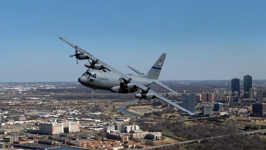 A C-130 from the136th Airlift Wing, Texas Air National Guard, Fort Worth skims the skyscrapers over the city of Fort Worth as part of public relations demonstration, Jan. 12, 2009. (UASF Photo by Tech. Sgt. Charles Hatton)