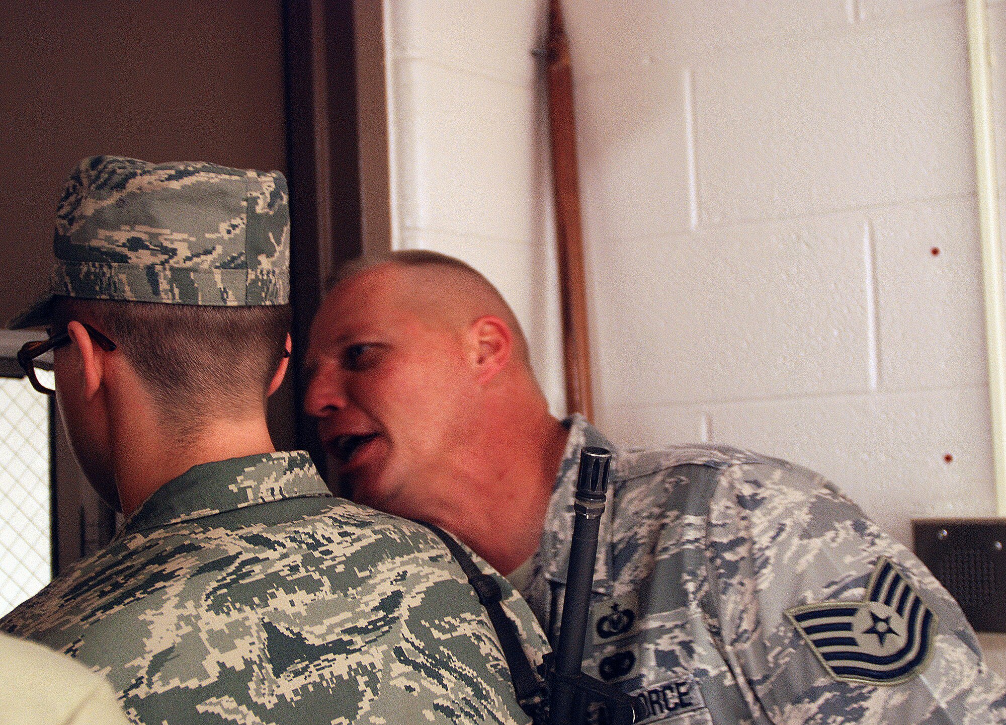 Technical Sgt. Terrance Thoe, a Reserve military training instructor from the 433rd Airlift Wing, emphasizes the importance of following proceedure to a basic trainee in the 326th Training Squadron. Sergeant Thoe, like many Reservists, works side by side with active duty personnel. (U.S. Air Force photo/Airman Brian McGloin)