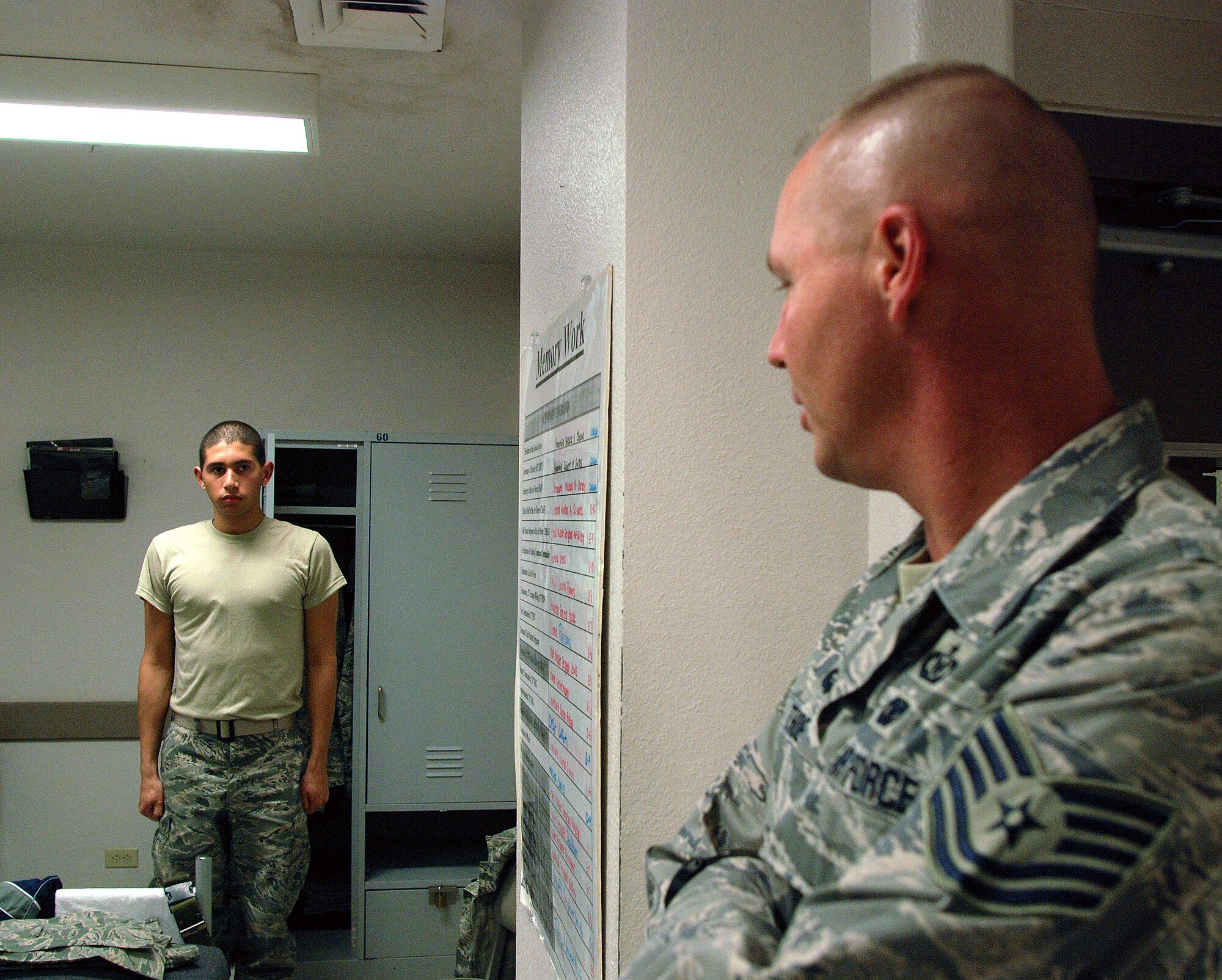 Technical Sgt. Thoe, a Reservist with the 433rd Airlift Wing and a military training instructor, speaks with a basic trainee in the 326th Training Squadron. Sergeant Thoe and other Reservists work in concert with active-duty MTI's to meet requirements at Lackland AFB's Basic Military Training program. (U.S. Air Force Photo/Airman Brian McGloin)