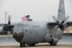 Air Force Command Chief Master Sgt. Johnny Jones of the 136th Airlift Wing holds up an American flag after completing his last mission during the March Unit Training Assembly, Carswell Field, Texas, March 21, 2009.(USAF Photo Master Sgt.Michael Lachman)