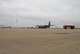 Aircraft Crash Fire trucks from NAS JRB, Fort Worth, Texas, give a water salute to an Air Force C-130 aircraft from the 136th Airlift Wing, Texas Air National Guard to congratulate Command Chief Master Sgt. Johnny Jones of the 136th Airlift Wing as he completes his last mission during the March Unit Training Assembly, March 21, 2009.(USAF Photo Master Sgt.Michael Lachman)