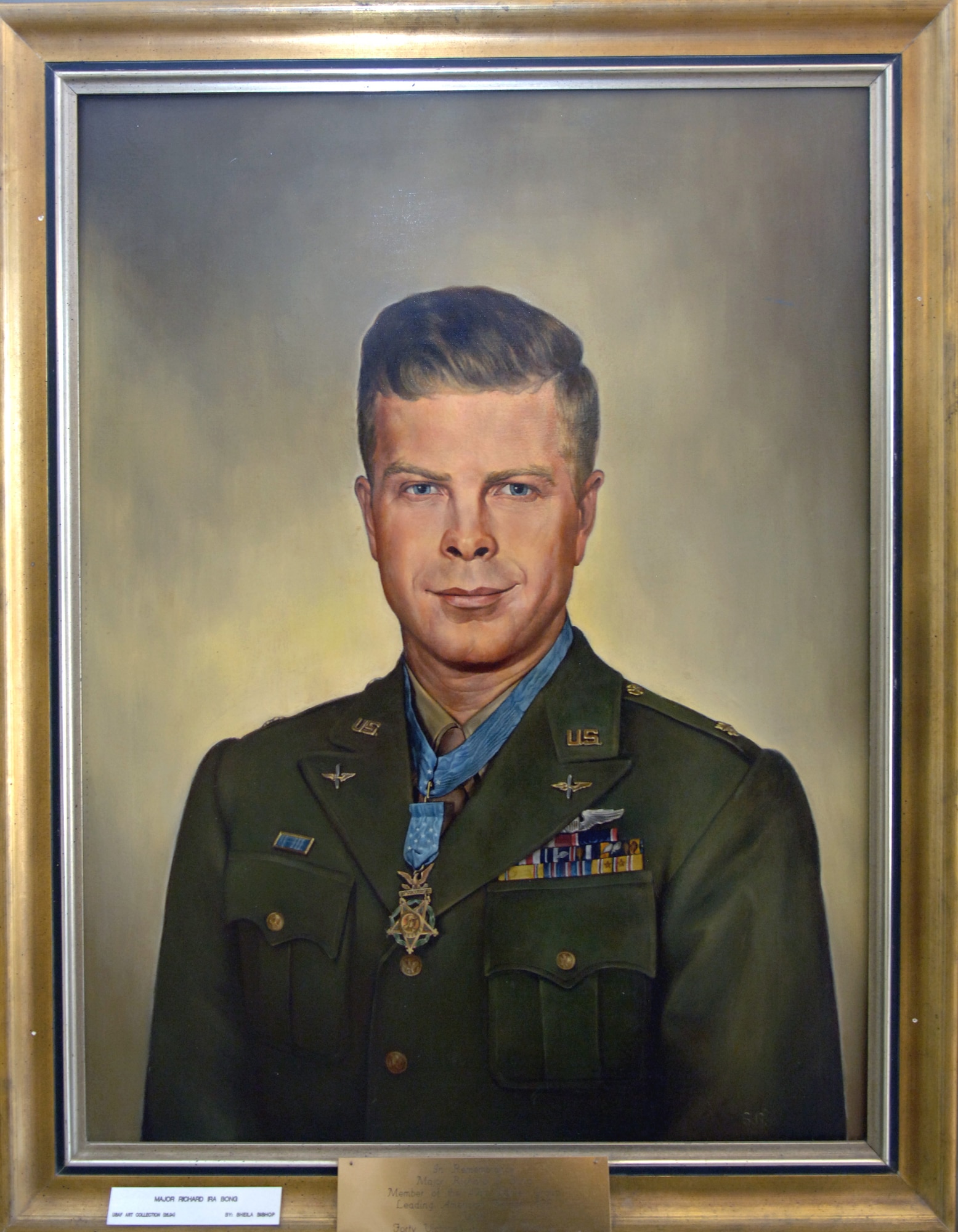 Richard Ira "Dick" Bong (Sept. 24, 1920 - Aug. 6, 1945) is the United States' highest-scoring ace, having shot down 40 Japanese aircraft during World War II, and is a Medal of Honor recipient. He was a fighter pilot in the U.S. Army Air Forces assigned to the 49th Pursuit Group (now the 49th Fighter Wing at Holloman Air Force Base, N.M.). His portrait hangs in the wing headquarters building along with photos from his days as a "Fightin' Forty-Niner." (U.S. Air Force photo/Airman 1st Class Veronica Salgado)
