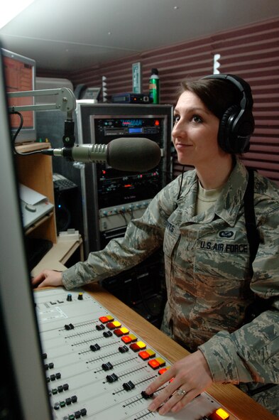 Senior Airman Holly Roberts, a broadcaster with the 732nd Expeditionary Support Squadron's American Forces Network-Iraq, runs the switchboard during her radio broadcast March 4 in Baghdad. Airman Roberts is deployed from Spangdahlem Air Base, Germany.  (U.S. Air Force photo/Tech. Sgt. Craig Lifton)