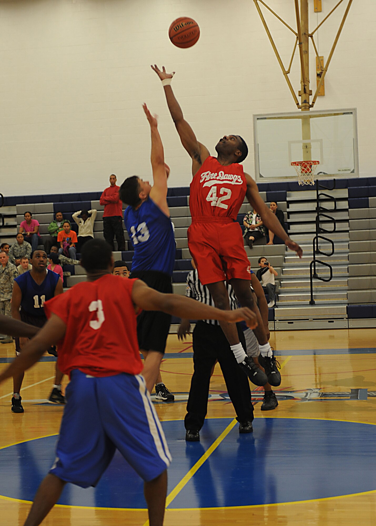 CANNON AIR FORCE BASE, N.M. - Tech. Sgt. Robert Nora, 27th Special Operations Civil Engineer Squadron, goes up for the jump ball against Steven Seifen, 27th Special Operations Force Support Squadron March 18. 27 SOCES was victorious with a 50-42 win, making this the third consecutive year they?ve won the championship. (U.S. Air Force photo/Airman 1st Class Evelyn Chavez)