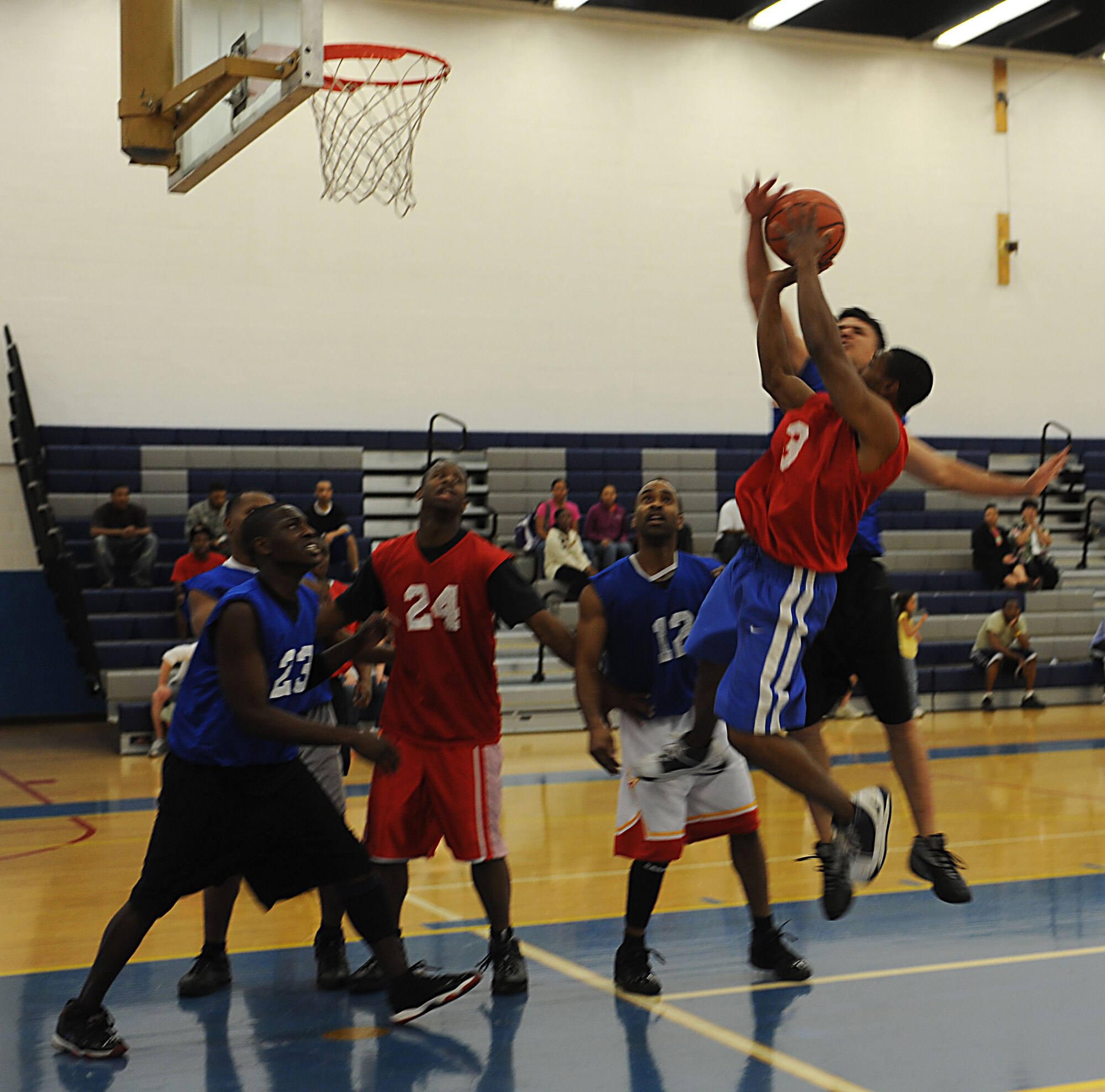 CANNON AIR FORCE BASE, N.M. - A player with the 27th Special Operations Civil Engineer Squadron goes up for a shot against team members of the 27th Special Operations Force Support Squadron during the base basketball intramural championship game. 27 SOCES defeated 27 SOFSS 50-42 March 18. The victory gave 27 SOCES their three-peat championship title. (U.S. Air Force photo/Airman 1st Class Evelyn Chavez)