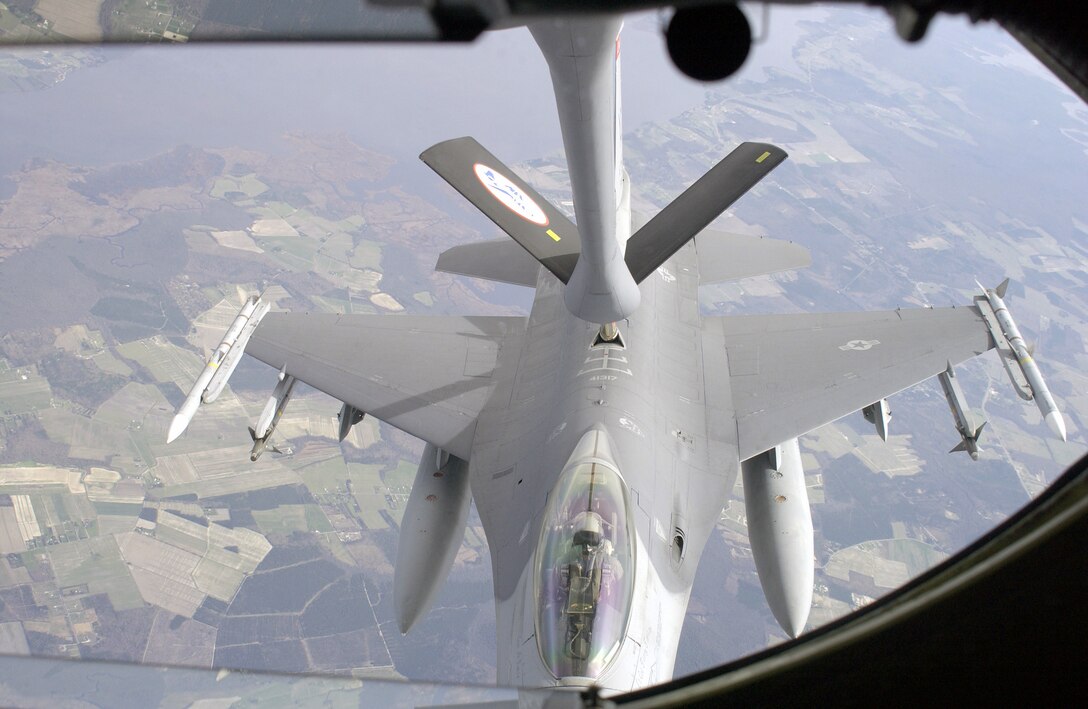 A US Air Force (USAF) F-16C Fighting Falcon aircraft, 177th Fighter Wing (FW), Atlantic City International Airport, New Jersey (NJ), receives JP8 fuel above the USA from a USAF KC-135R Stratotanker, 157th Air Refueling Wing (ARW), Pease Air National Guard Base (ANGB), New Hampshire (NH).  This is a Combat Air Patrol (CAP) tanker mission in support of Operation NOBLE EAGLE. The F-16 is armed with AIM-120A Advanced Medium Range Air-to-Air Missiles (AMRAAM) on the wingtips and AIM-9 Sidewinder Missiles on the outboard pylons. In addition, it has two 370-gallon External Fuel Tanks for long loitering flight time.  (U.S. Air Force photo/Staff Sgt. Dawn Finniss)