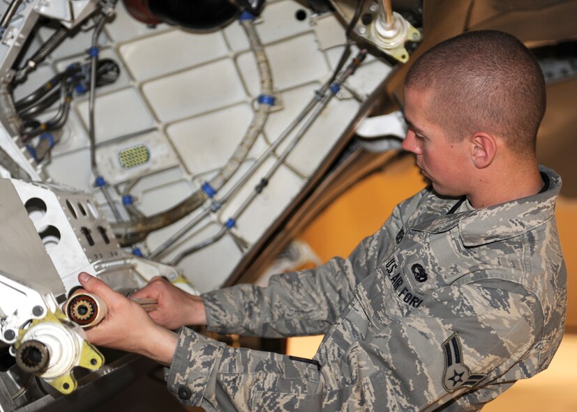 Airman 1st Class Sean Ivers, 49th Aircraft Maintenance Squadron, performs maintenance on the F-22A Raptor, March 19, at Holloman Air Force Base, N.M. The 49th Maintenance Group directs all maintenance, qualification, on-the-job and ancillary training for more than 1,200 people and manages $4.3 billion in aircraft and equipment. U.S. Air Force photo/Airman 1st Class Rachel Kocin)
