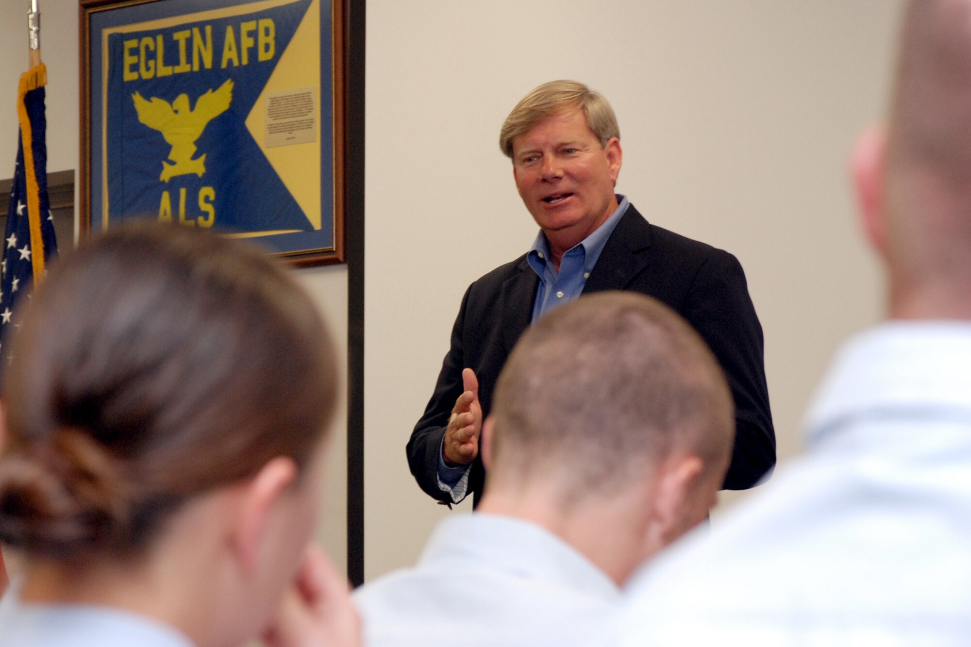 EGLIN AIR FORCE BASE, Fla. -- Ken Hair, Children in Crisis, Inc. executive director and a retired chief master sergeant, speaks to an Airman Leadership School class at the Enlisted Professional Development Center here March 23. The ALS class donated $200 to the local non-profit organization who provides homes and establishes hope to abused, neglected and abandoned children in the local community. The goal of ALS is to develop Airmen into effective front-line supervisors in the noncommissioned officer corps. (U.S. Air Force photo by Staff Sgt. Mike Meares)