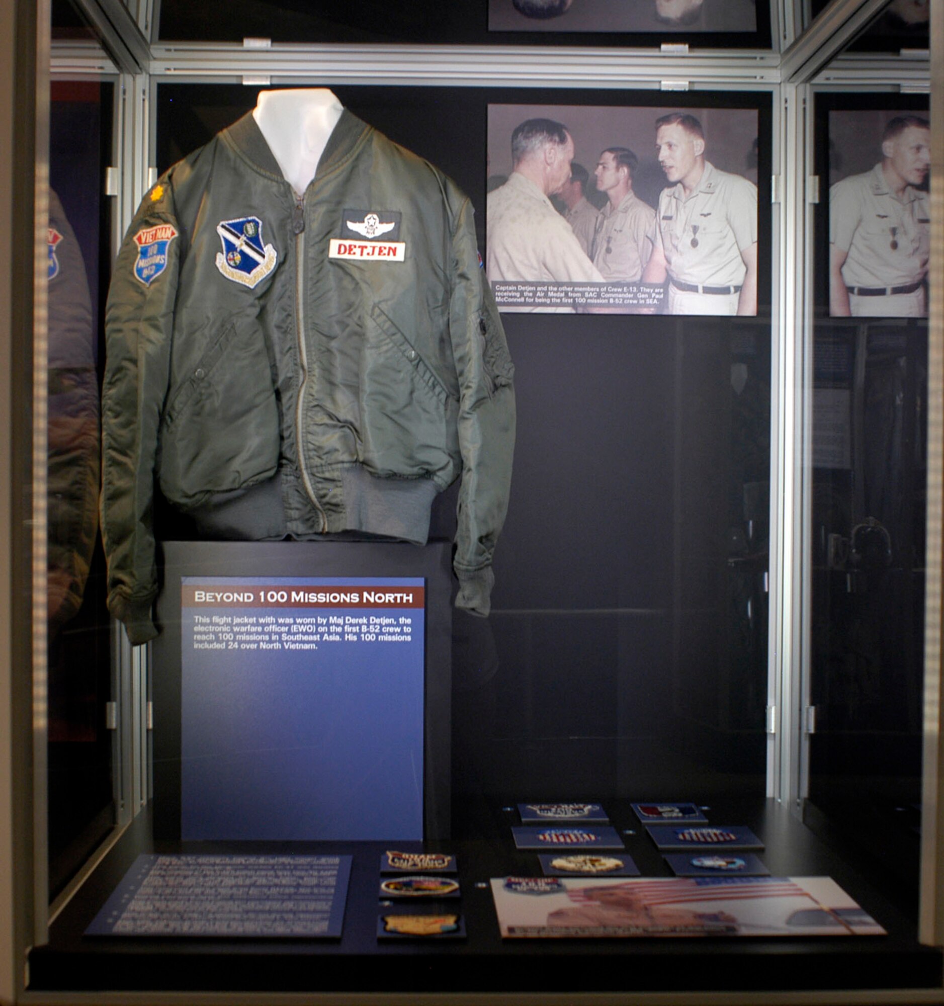 DAYTON, Ohio - On display: Many B-52 crewman tracked Arc Light ground attack strikes by wearing F-105 style patches with “South Vietnam” at the top instead of “North Vietnam.” This one was worn by Capt. Michael McGuinness, a bomb-navigator on B-52s. This flight jacket with was worn by Maj. Derek Detjen, the electronic warfare officer (EWO) on the first B-52 crew to reach 100 missions in Southeast Asia. His 100 missions included 24 over North Vietnam.This patch for the electronic warfare EC-47 was donated by Capt. John Franklin, III. This variation of the F-105 patch came from two AC-119K flight engineers. The 100 mission patch was worn by Master Sgt. Art Perry and the 120-mission patch by Airman 1st Class John Wolff. This patch was donated by Steven Fritts, who was assigned to the 43rd Security Police Squadron, Eighth Air Force Headquarters, at Andersen Air Base, Guam, during Linebacker operations. The CBF is for Central Base Funds, and it appears that Fritts probably drove many high level officers around on the base.This humorous patch came from Korat RTAFB. The bus to town cost two baht (or about 10 cents U.S.) and drove on a road at the end of the runway. So, 100 take-offs would equal 100 missions over the two baht bus. Ground personnel wore this whimsical patch representing 100 trips on the local bus. This patch made fun of boring but necessary administrative duties assigned to some aircrew. The “duty pig” worked a shift at the squadron operations desk answering the phone, posting the flight schedule, and checking aircraft available. “Mobile” was sitting in the mobile control tower taking note of flights coming in and going out. This patch was made for missions flown during OPERATION DESERT STORM in 1991. Although the colors are different, the overall shape is clearly from the original F-105 patch. The 100 mission patch tradition reaches to OPERATION ENDURING FREEDOM (OEF) and OPERATION IRAQI FREEDOM (OIF). In 2005, the donor, Lt. Col. Tim Sipes, then-commander 