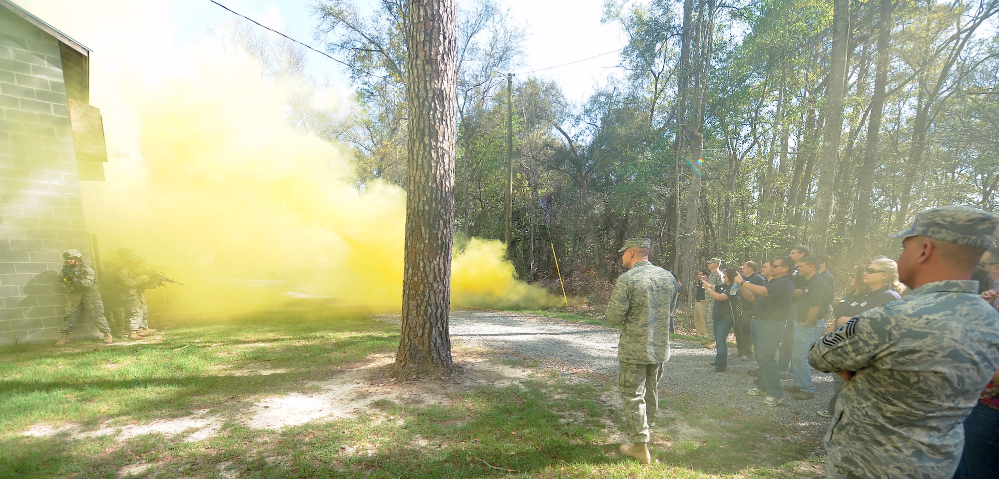 MOODY AIR FORCE BASE, Ga. -- Airmen from the 820th Security Forces Group demonstrate tactical operations during a military operations in urban terrain training scenario for members from the Leadership Lowndes class here March. 11. The simulated wartime event included smoke grenades, snipers, fire fights and detained hostages. (U.S. Air Force photo by Airman Joshua Green) 