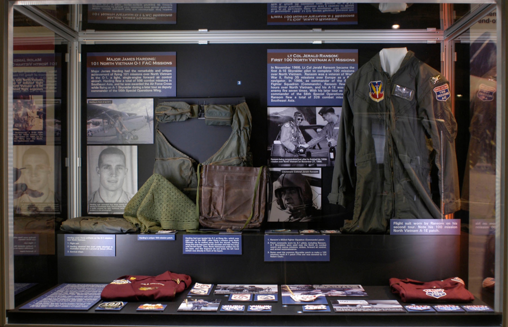 DAYTON, Ohio - On display (top right) Flight suit worn by Lt. Col. Jerald Ransom on his second tour. Note his 100 missions North Vietnam A-1E patch. Ransom’s 602nd Fighter Squadron (Commando) patch. A patch commonly worn by A-1 pilots, including Ransom. A-1 Skyraiders were used over the North on combat search and rescue missions, strikes, forward air control, and armed reconnaissance. Some used the common Skyraider patch to make a 100 missions north A-1 patch (The one on display was donated by Col. Robert Clark). (U.S. Air Force photo)
