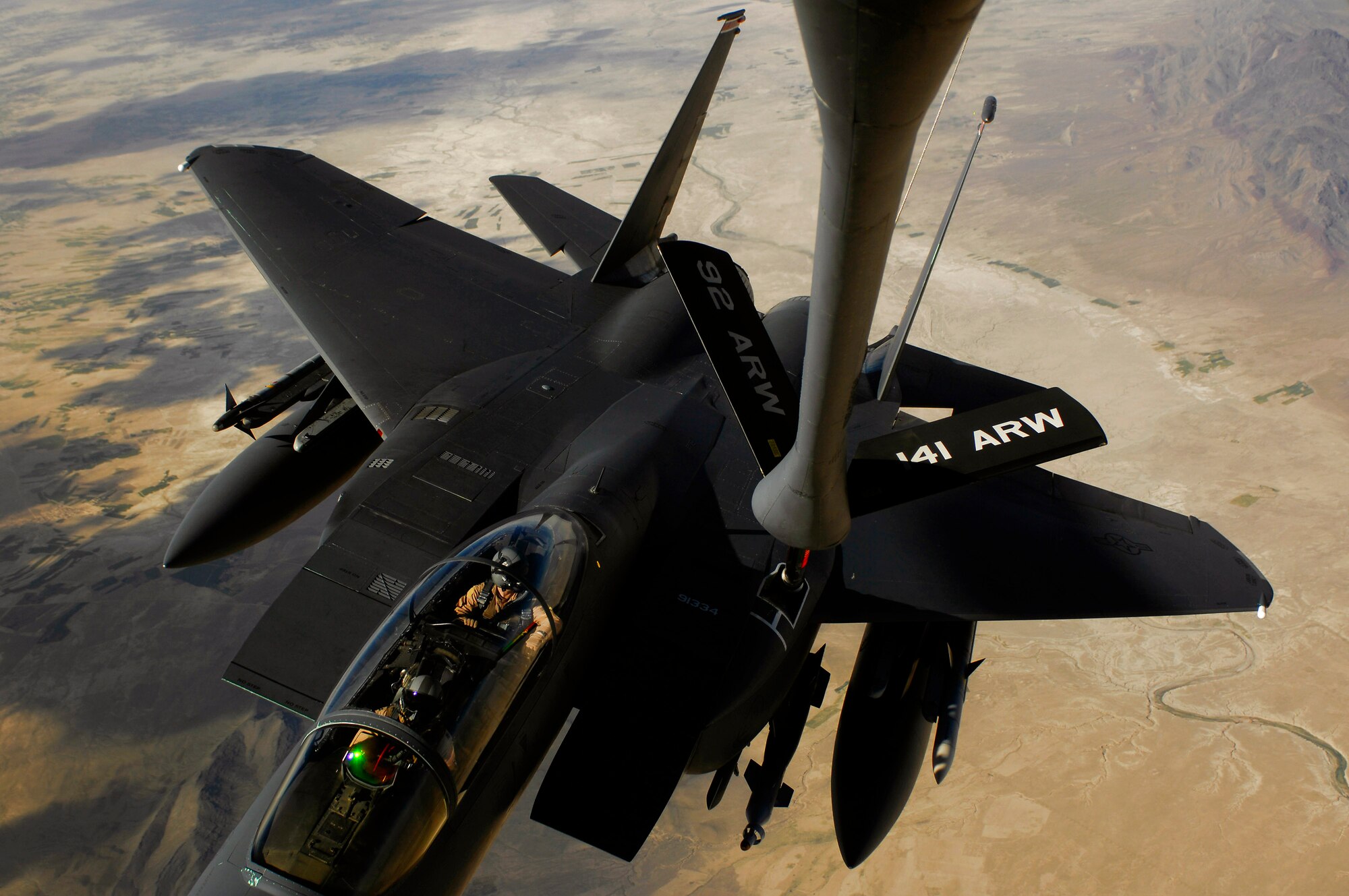 An F-15E Strike Eagle aircraft receives fuel from a KC-135 Stratotanker during a mission over Afghanistan. The F-15E provides close-air support and armed aerial overwatch to deter enemy activities. (U.S. Air Force photo/Master Sgt. Andy Dunaway) 