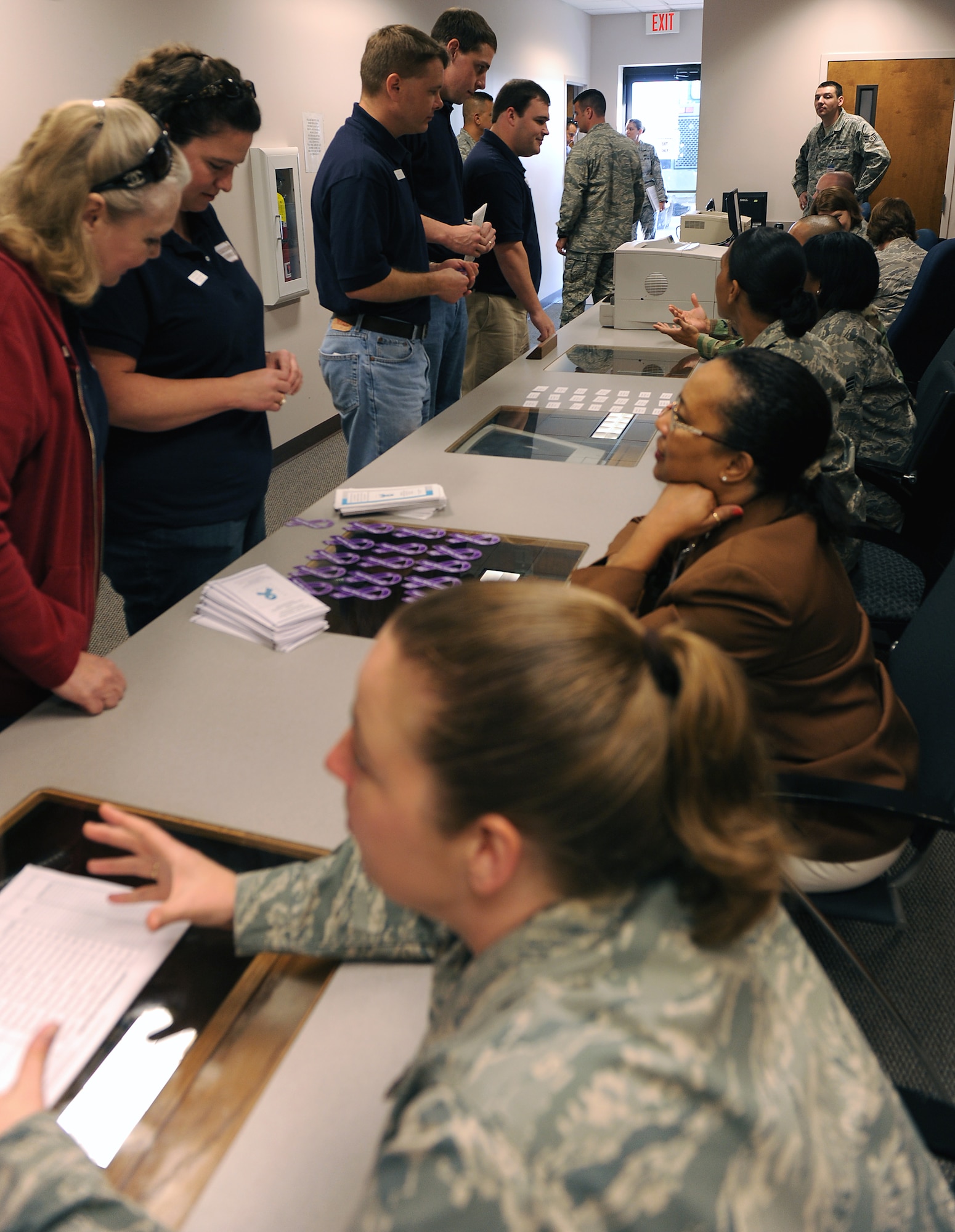 MOODY AIR FORCE BASE, Ga. -- Members from the Leadership Lowndes class process through a simulated deployment line here March 19. Each person who represented an agency in the deployment line explained the purpose of every station to give a better understanding of what requirements are needed before each deployment. (U.S. Air Force photo by Airman Joshua Green) 

