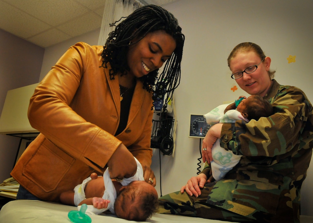 Capt. (Dr.) Melinda B. Batman, 779th Medical Group, Pediatrician, exams twin 4-month olds Nicole and Victoria Hopkins, during a routine well baby appointment March 12, 2009.   Dr. Batman has been selected as one of the 79th Medical Wing's physicians to highlight within the wing for National Doctor's Appreciation Day March 30th.  (U.S. Air Force photo by Tech. Sgt. Suzanne M. Day)(Released)

