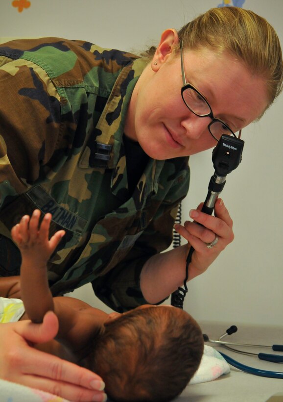Capt. (Dr.) Melinda B. Batman, 779th Medical Group, Pediatrician, exams twin 4-month old Nicole Hopkins, during a routine well baby appointment March 12, 2009.   Dr. Batman has been selected as one of the 79th Medical Wing's physicians to highlight within the wing for National Doctor's Appreciation Day March 30th.  (U.S. Air Force photo by Tech. Sgt. Suzanne M. Day)(Released)
