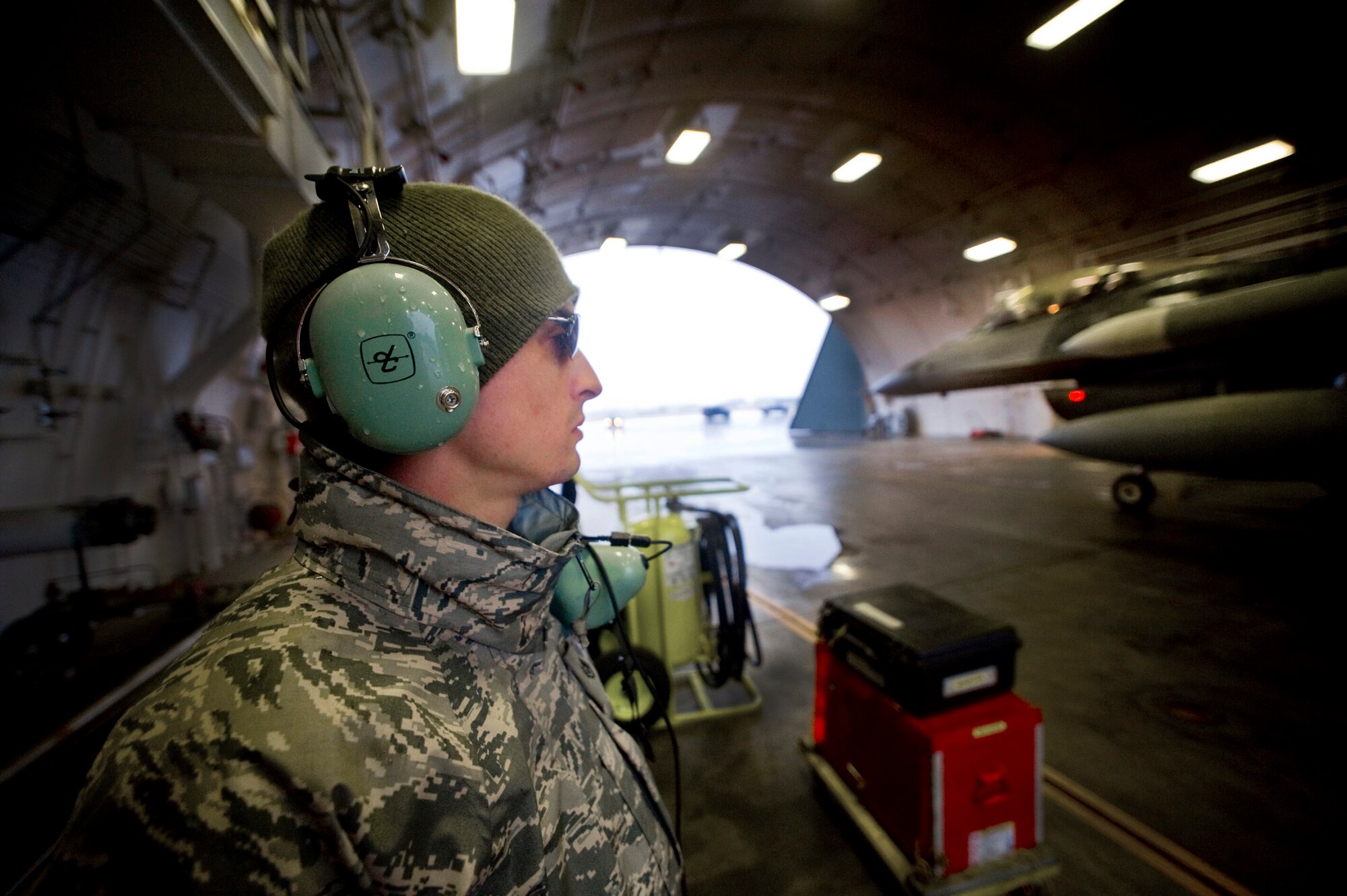 Staff Sgt. Benjamin Casarez stands by to help power down a returning jet March 6 at Misawa Air Base, Japan. Sergeant Casarez is an F-16 Fighting Falcon crew chief deployed from McEntire Air National Guard Station, S.C. He is one of 31 Air National Guardsmen assigned to help fill manning shortages throughout the 35th Maintenance Group. (U.S. Air Force photo/Staff Sgt. Samuel Morse) 
