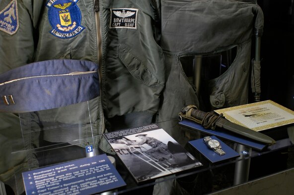 DAYTON, Ohio - Close-up of objects in the First F-105 100 Mission Tour exhibit case in the 100 Missions Up North exhibit in the Southeast Asia War Gallery at the National Museum of the U.S. Air Force. (U.S. Air Force photo)
