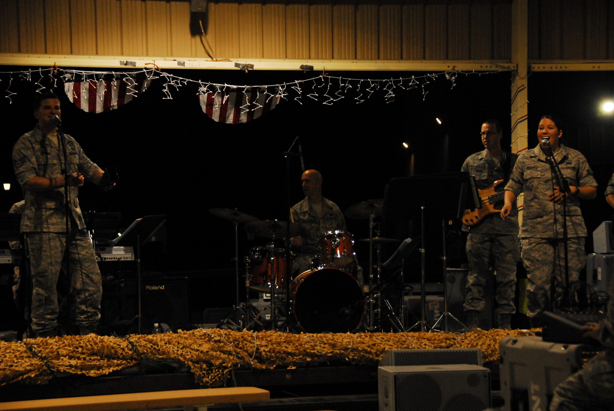 SOUTHWEST ASIA -- Oasis, 10-piece Air Force Central Band, entertains the Airmen of the 386th Air Expeditionary Wing in an outdoor concert at an air base in Southwest Asia, March 22. The band's mission is to provide morale support for deployed servicemembers. (U.S. Air Force photo/Senior Airman Courtney Richardson)