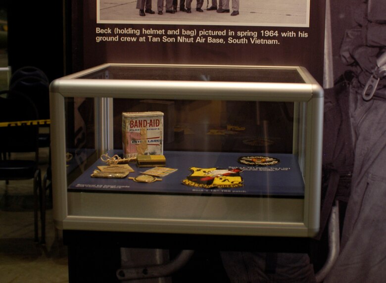 DAYTON, Ohio - Survival kit hand-made and carried by Capt. Donald Beck, the first pilot to reach 100 "counters". Also displayed is Beck’s F-101 patch (the F-101 Voodoo was known as the “one-oh-wonder.”) and his 15th TRS patch. These items are on display in the 100 Missions Up North exhibit in the Southeast Asia War Gallery at the National Museum of the U.S. Air Force. (U.S. Air Force photo)