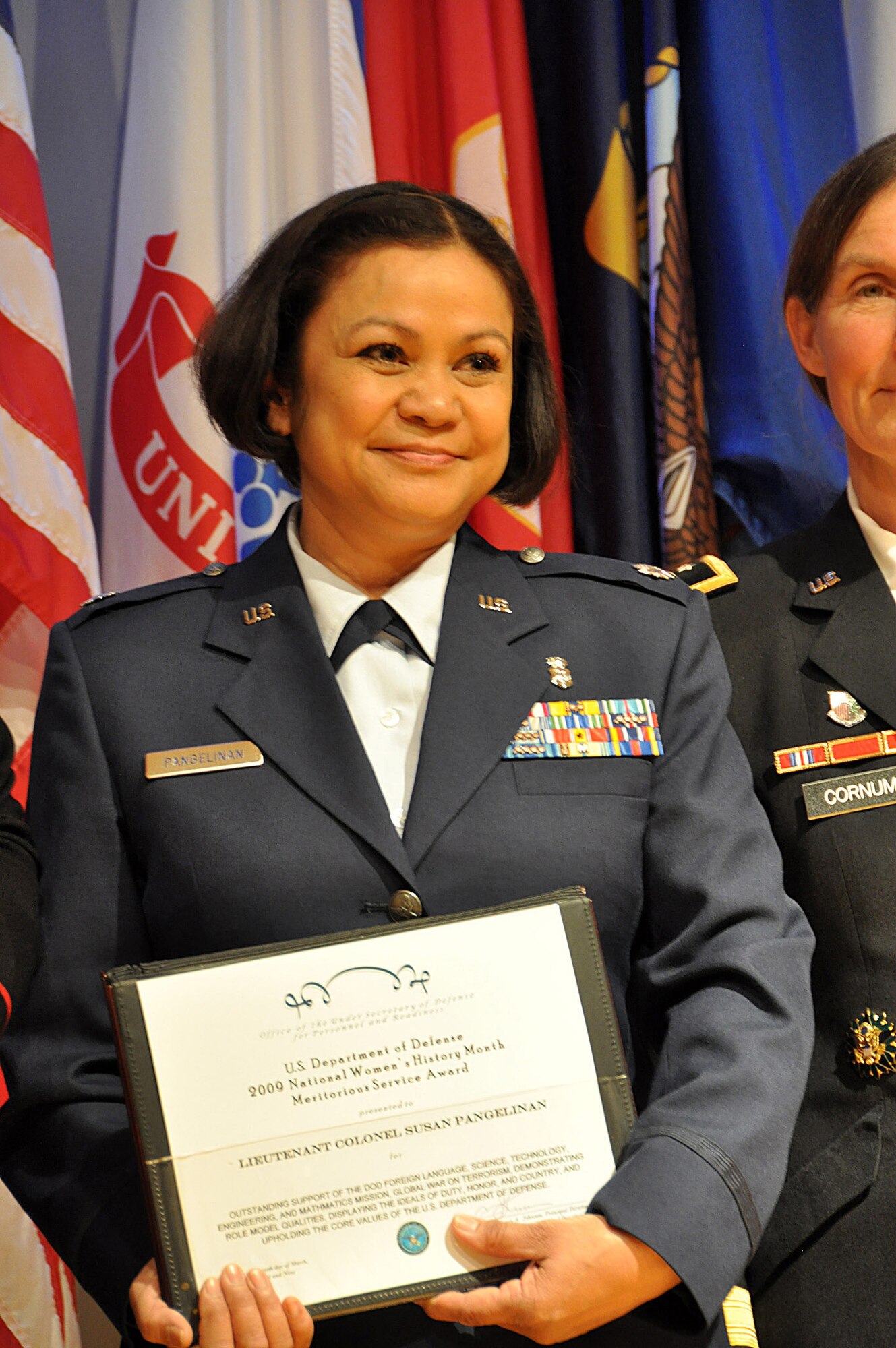 Air Force Lt. Col. Susan Pangelinan from the California National Guard is awarded a DoD Science, Technology, Engineering and Math (STEM) award March 19 at the Women in Military Service for America (WIMSA) Memorial, Arlington, Va., for her accomplishments as a medical advisor to the California Guard's Joint Force Headquarters. The awards ceremony honored 10 servicemembers who have worked toward the development of women and minorities in foreign languages and the STEM fields. It coincides with many other programs, ceremonies and activities that are observing women's history this month.
(U.S. Air Force photo by Master Sgt. Mike R. Smith) (Released)

