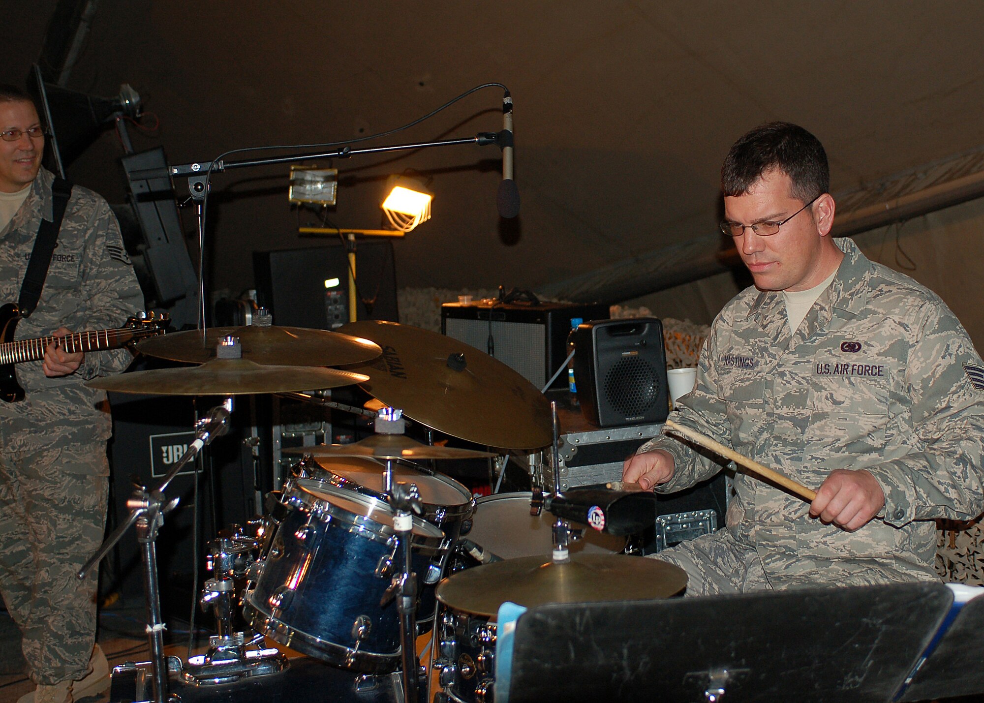Staff Sgt. Jeremy Hastings shows off his drumming skills as a guest performer with the band Sirocco, the U.S. Air Forces Central Expeditionary Band, during their final performance at Manas Air Base, Kyrgyzstan, March 21, before heading back to Southwest Asia. Sergeant Hastings is assigned to the 376th Expeditionary Logistics Readiness Squadron. He is an Alabama Air National Guardman deployed from the 187th Fighter Wing at Dannelley Field in Montgomery. (U.S. Air Force photo/Tech. Sgt. Elizabeth Weinberg)