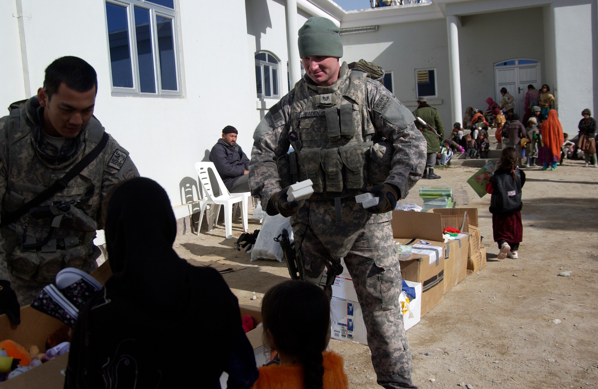 Nearly 200 children waited anxiously as Staff Sgt. Josh Paden and the members of the Zabul Provincial Reconstruction Team distributed the boxes filled with donations. Sergeant Paden, with the help of his mother, Diane Paden and the Pendleton County community in West Virginia, were able to give shoes, clothes and toys to the children of Qalat City, Afghanistan. (U.S. Air Force photo by 1st Lt. Amber Balken)