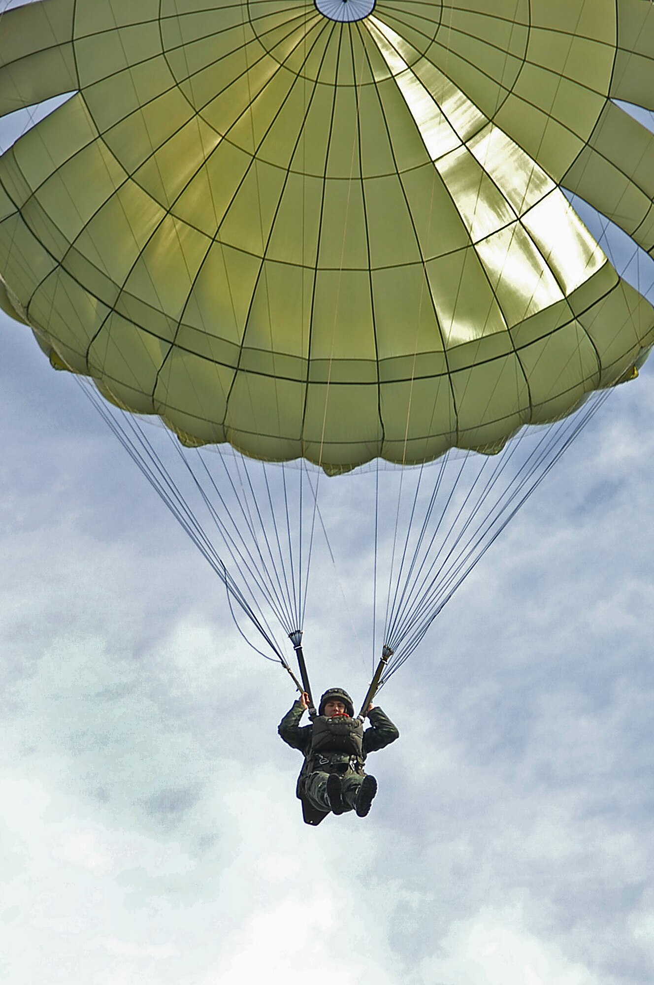 A Bulgarian paratrooper with the 68th Bulgarian Special Forces Brigade, parachutes down over the drop-zone after performing a static-line jump alongside U.S.paratroopers during Operation Thracian Spring , Bezmer Air Base, Bulgaria, March 9, 2009. Conducted annually since 2007, Operation Thracian Spring is a two week exercise allowing U.S. forces an opportunity to train and interact with their Bulgarian counterparts. (U.S. Air Force photo by Airman 1st Class Tony R. Ritter)