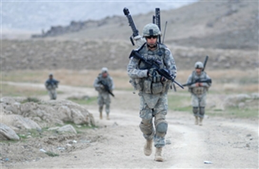 U.S. Army Sgt. Edward Westfield from Bravo Company, 1st Battalion, 4th Infantry Regiment, U.S. Army Europe leads his fire team back to base after a dismounted patrol mission near Forward Operating Base Baylough in the Zabul province of Afghanistan on March 20, 2009.  