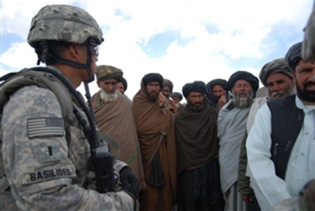 U.S. Army 1st Lt. Jason Basilides (left) listens as a group of villagers ask for supplies at the district center near Forward Operating Base Baylough in the Zabul province of Afghanistan on March 20, 2009.  Basilides is assigned to Bravo Company, 1st Battalion, 4th Infantry Regiment, U.S. Army Europe.  