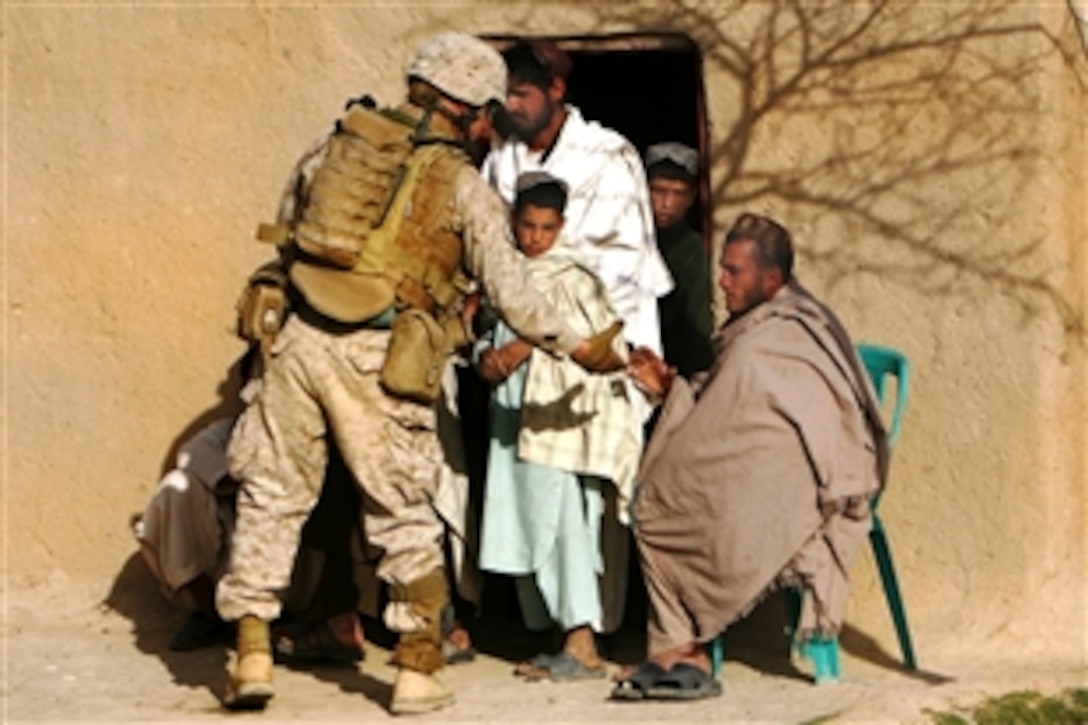 U.S. Marine Corps 2nd Lt. Daniel M. Yurkovich shakes hands with an Afghan after visiting his family’s home in Golestan, Farah province, Afghanistan, March 12, 2009. Yurkovich, assigned to Company K, 3rd Battalion, 8th Marine Regiment, spends much of his time engaging the local populace to gain intelligence on insurgent activity in the area.